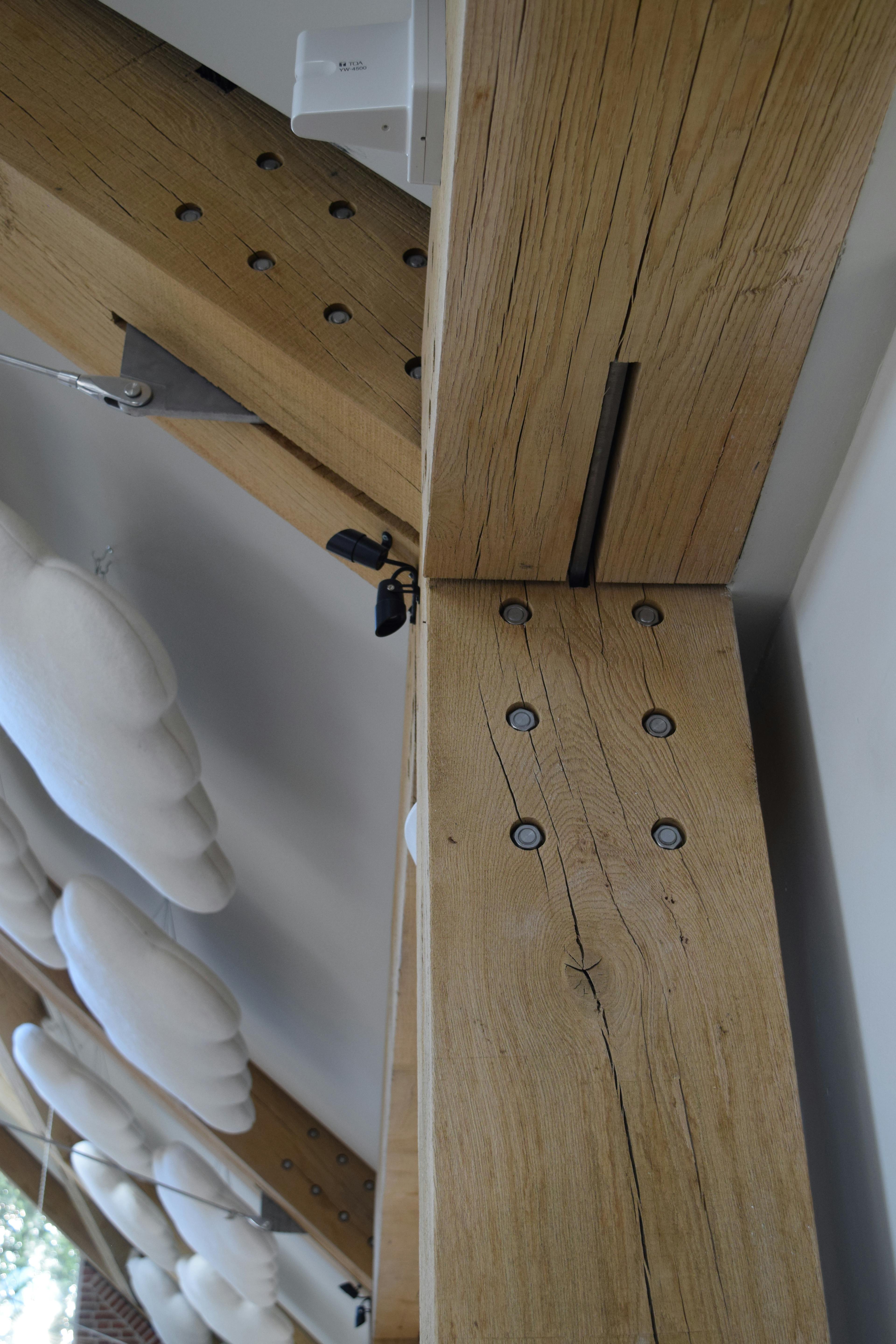 The ceiling of the Grange Hearing Dogs oak and steel framed gift shop showing a steel bolts and flitch plates