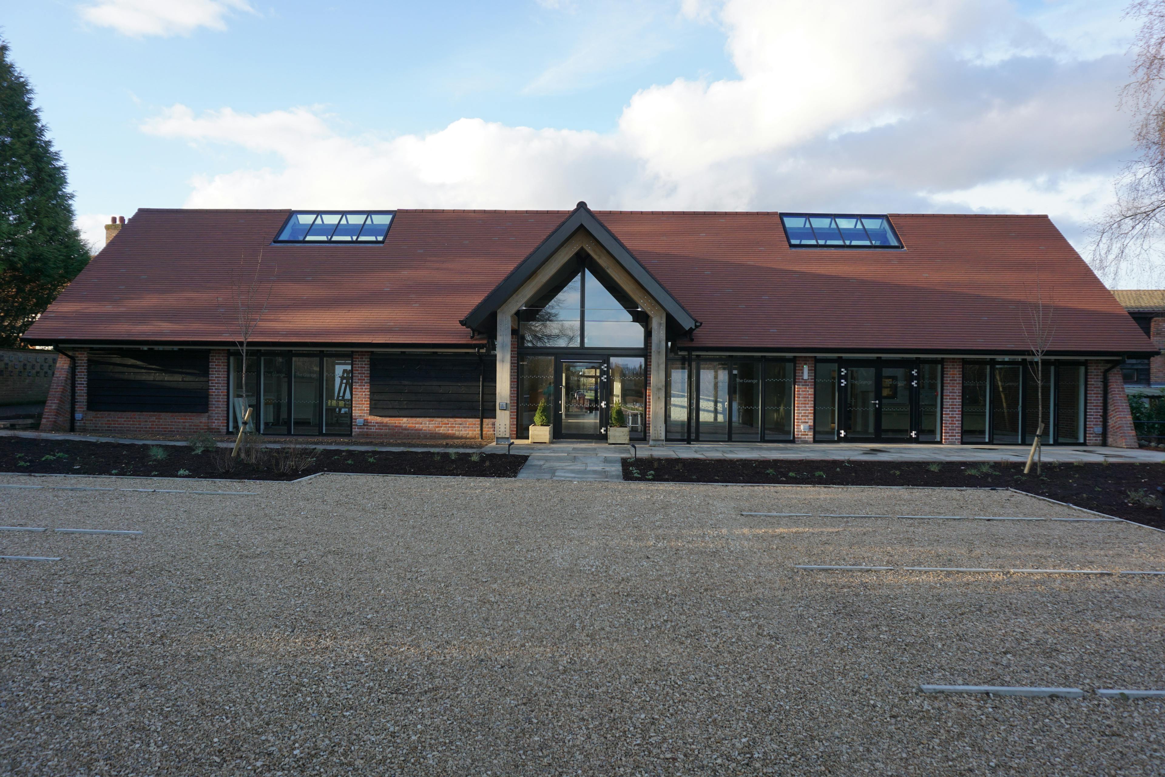 The Grange Hearing Dogs oak and steel framed restaurant and gift shop with a red sloped roof