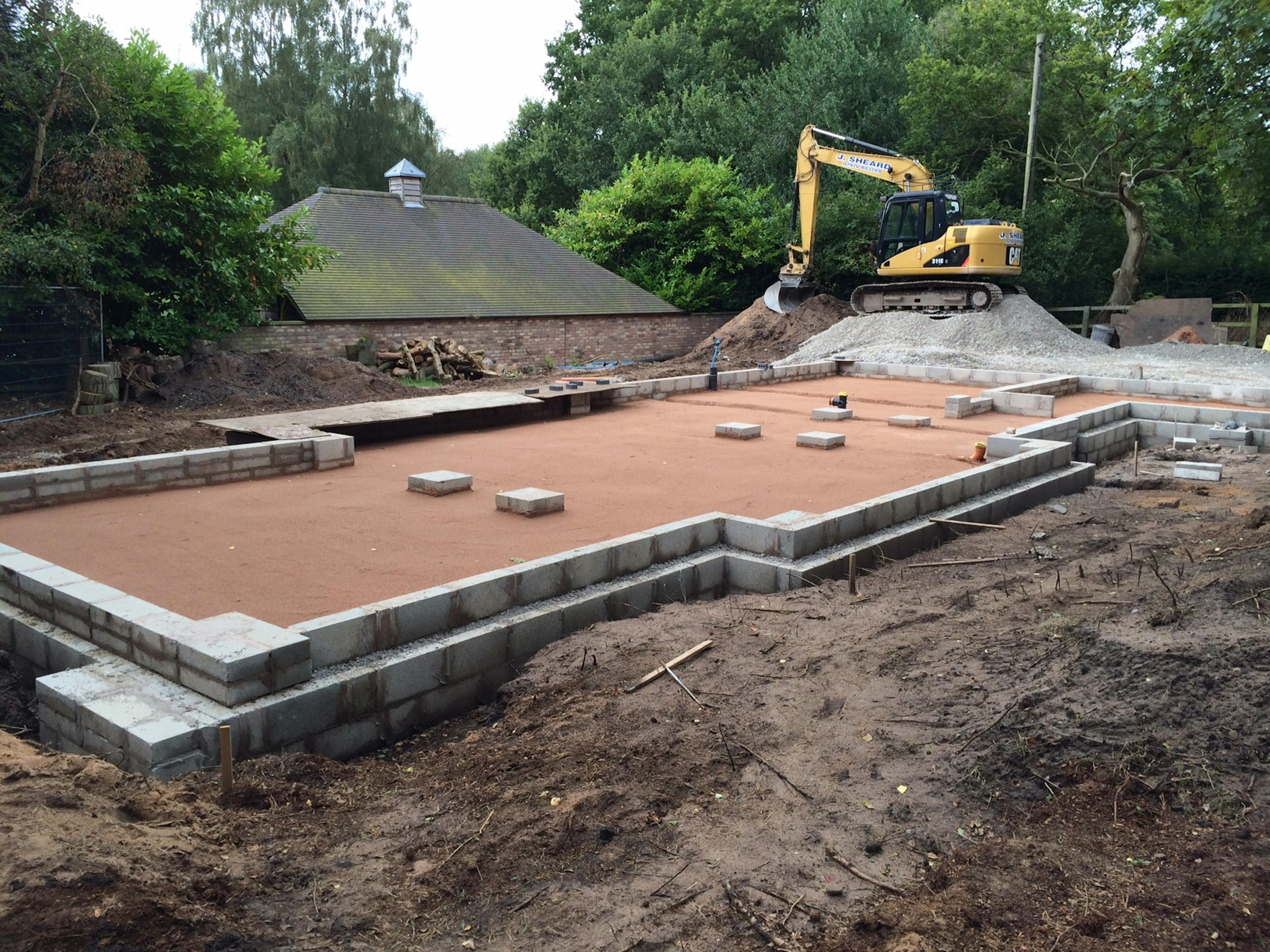 Concrete foundations are ready for an oak frame to be installed for a new home
