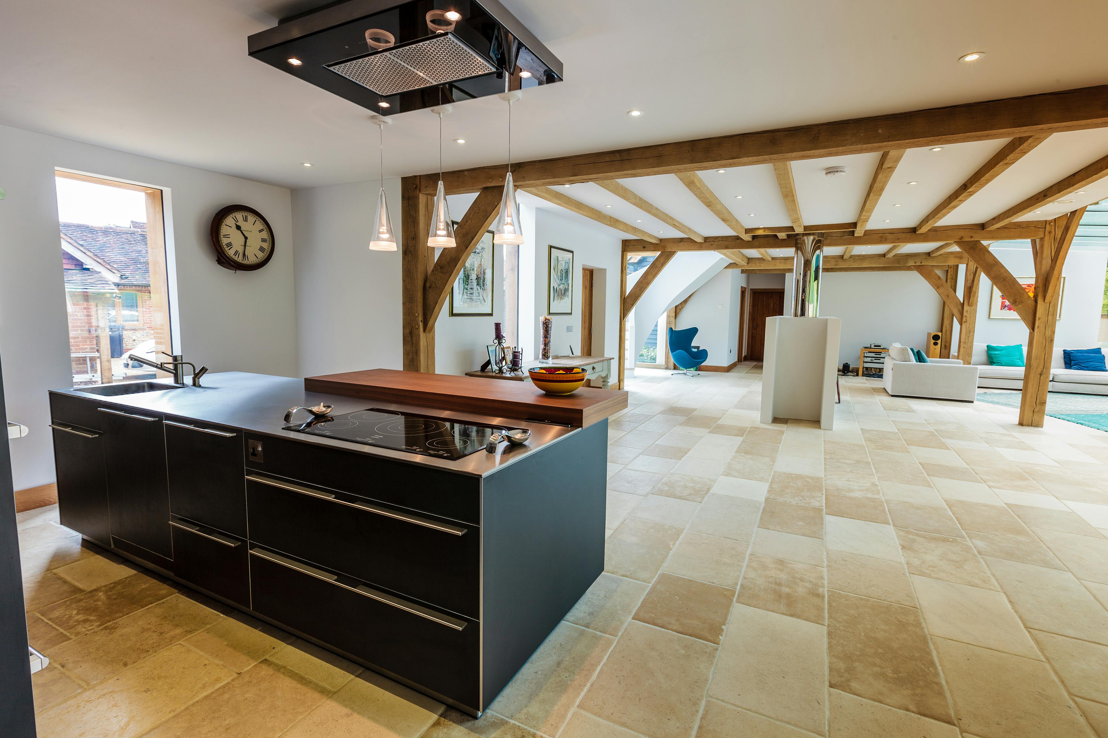 A modern oak framed open plan living area with kitchen and sitting areas