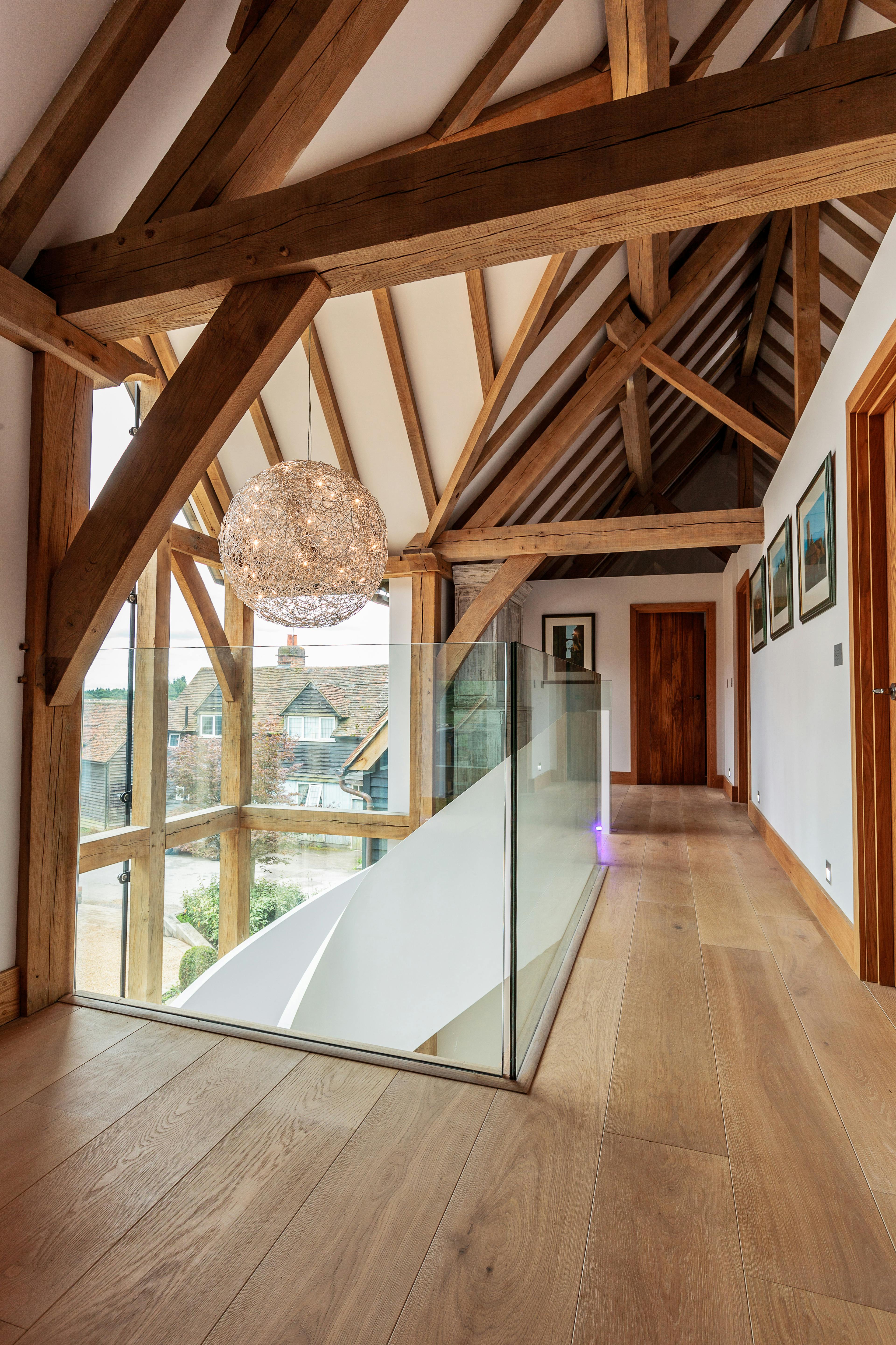 A landing in an oak framed house with wooden floors