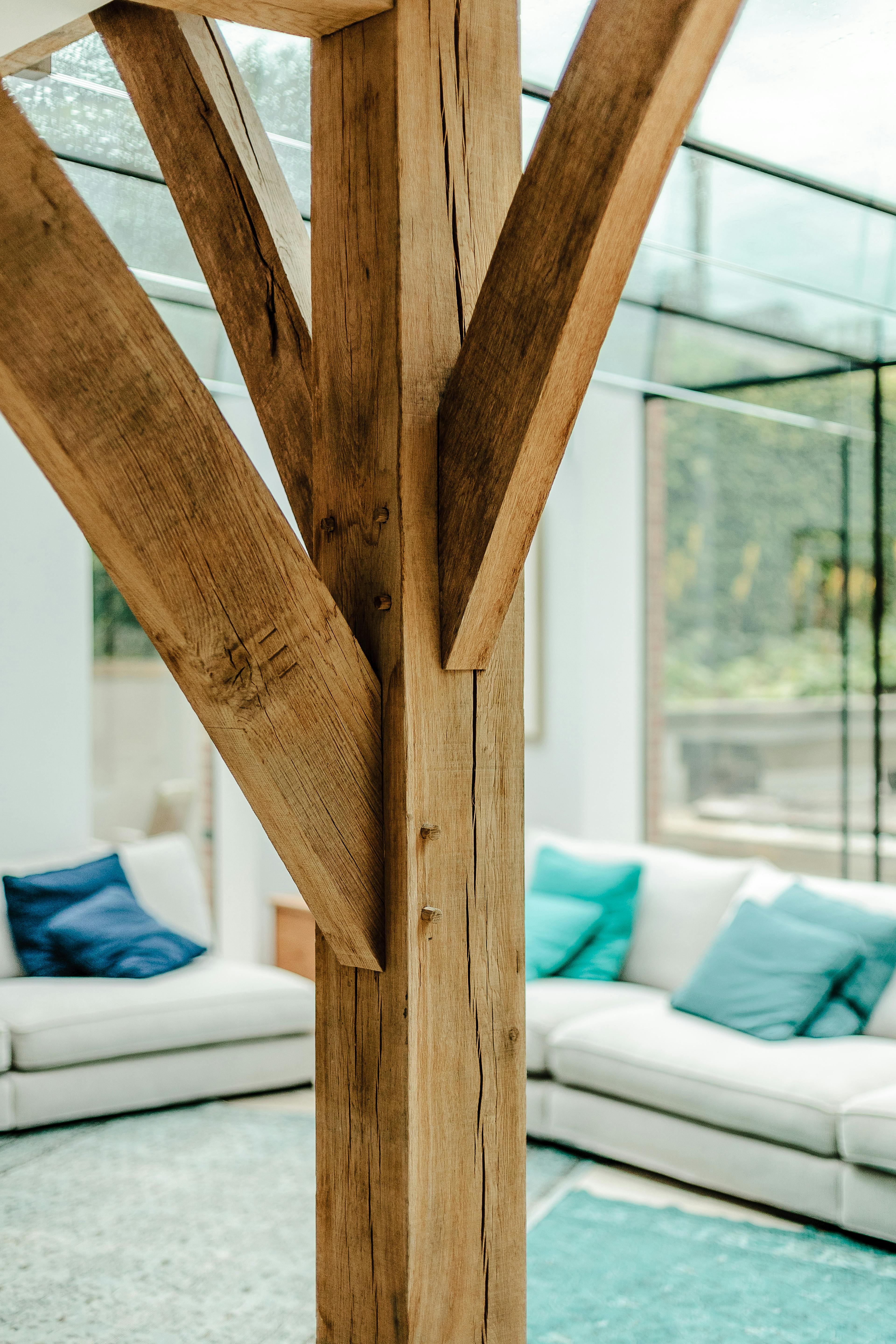 An oak post with three joining posts in an oak framed house