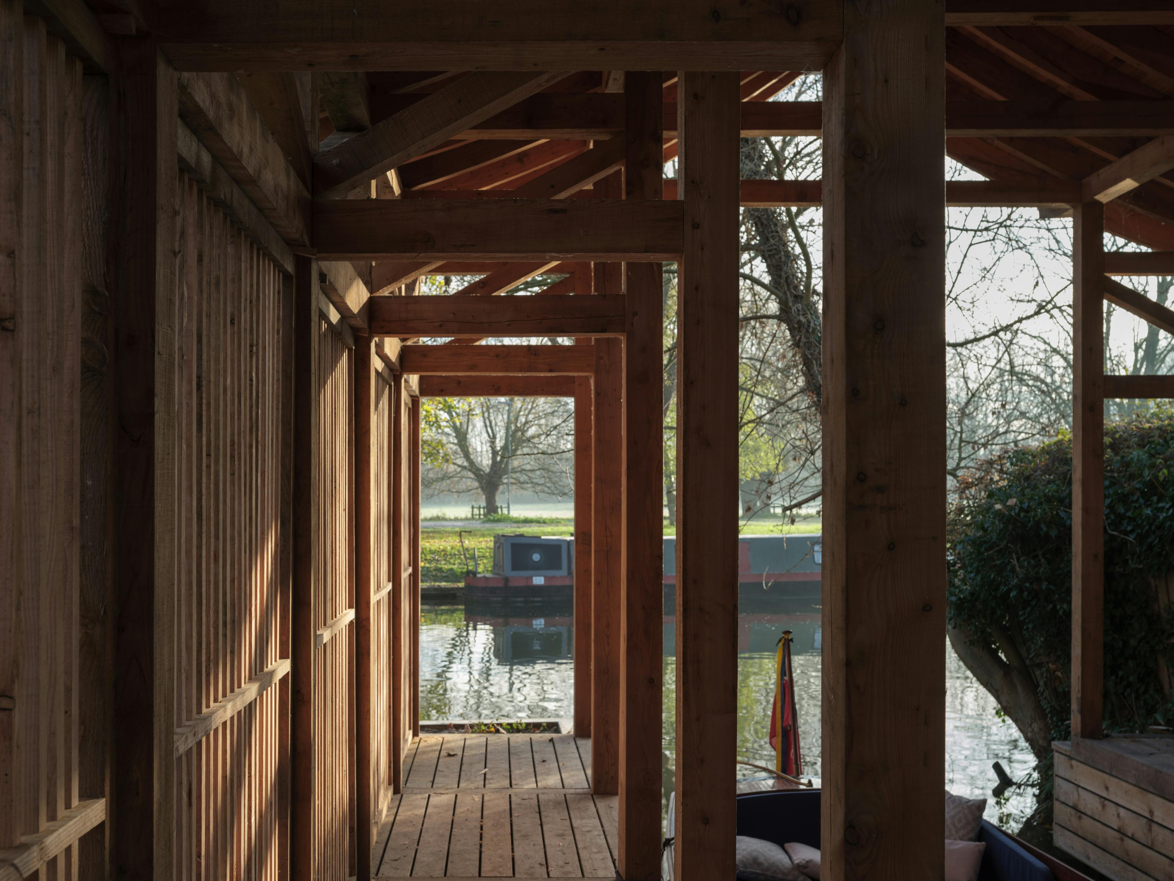 A larch japanese inspired boathouse by a river