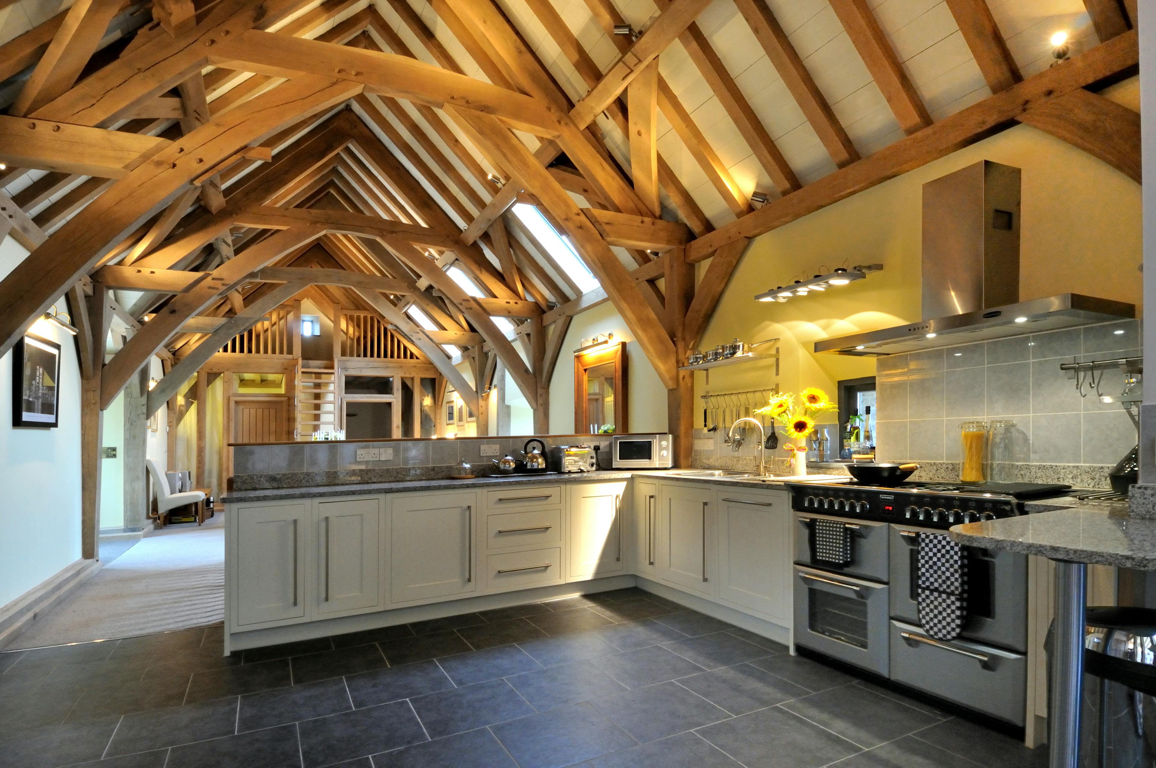 An oak framed kitchen with black slate flooring