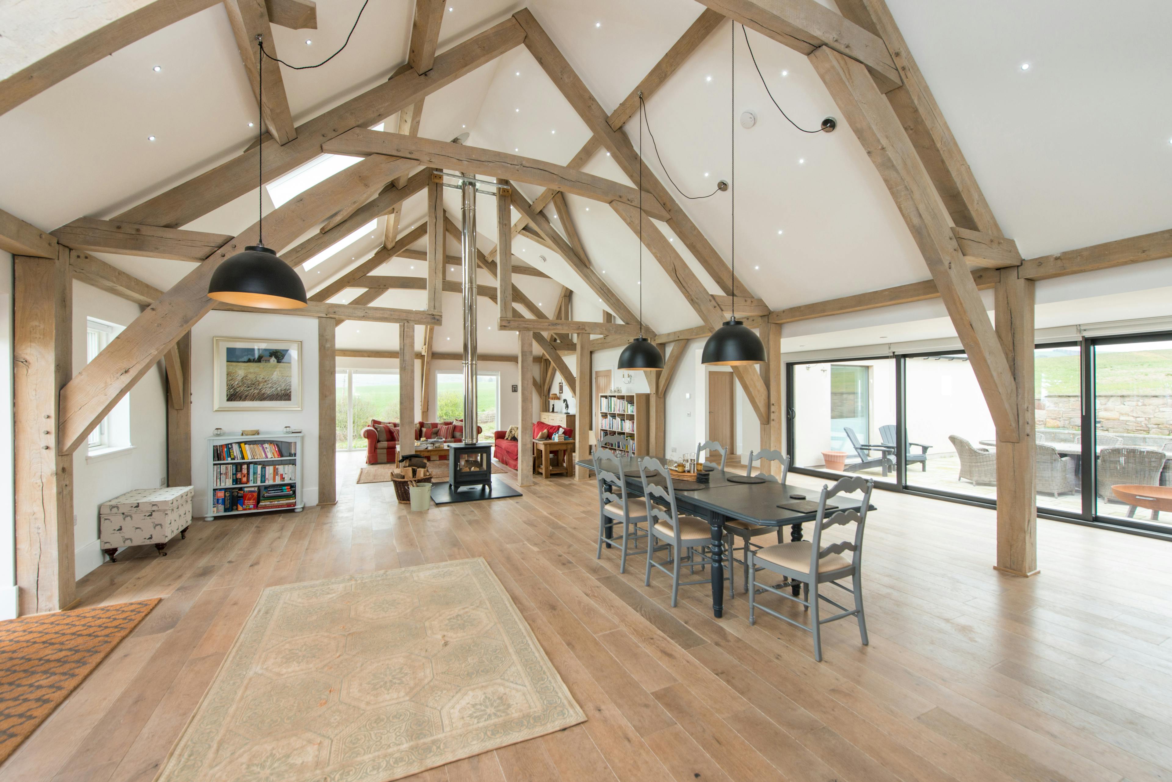 A vaulted oak framed open plan living, dining and sitting room