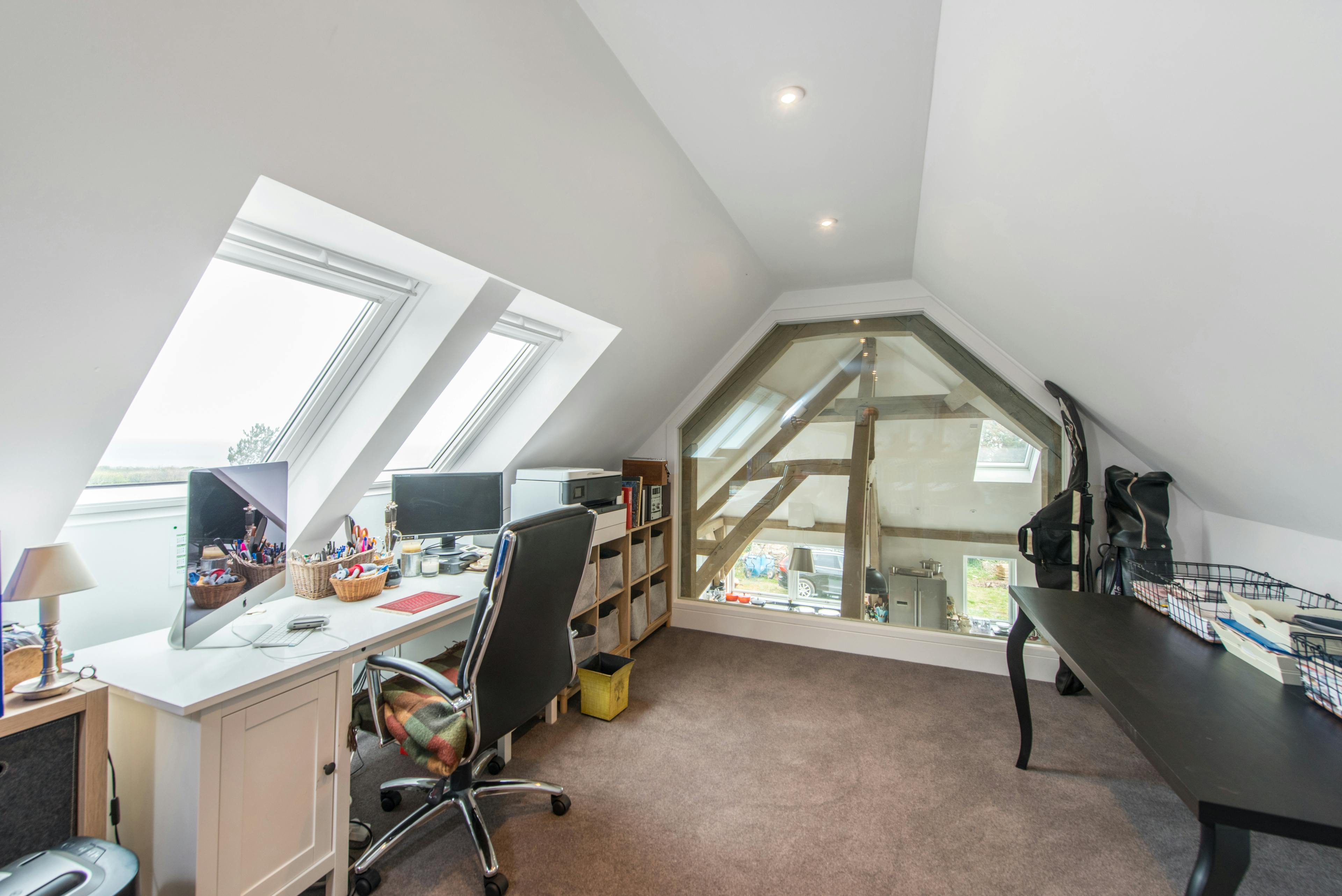 A vaulted oak frame roof with a mezzanine study area