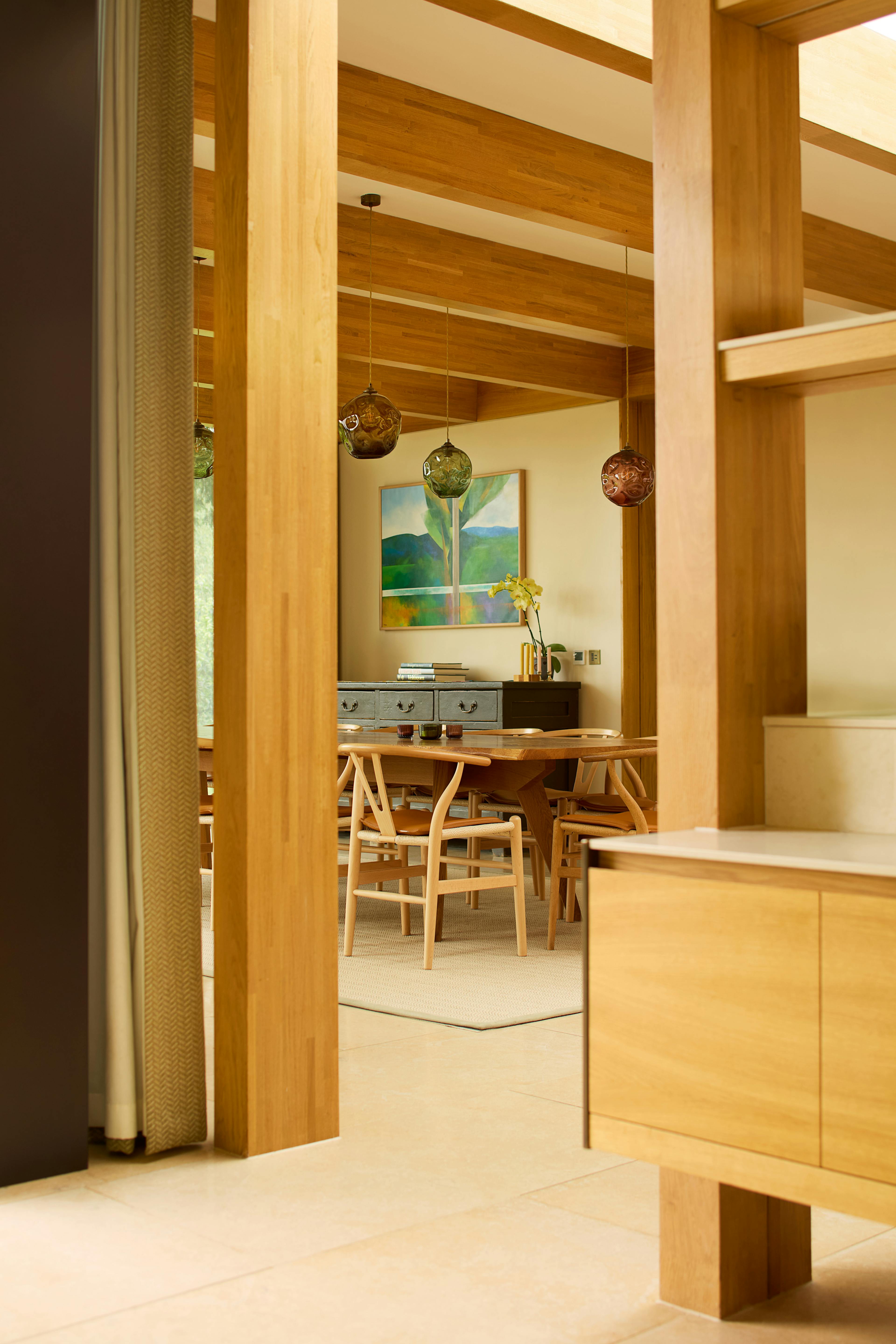 The dining area of an oak glulam extension to a listed manor house