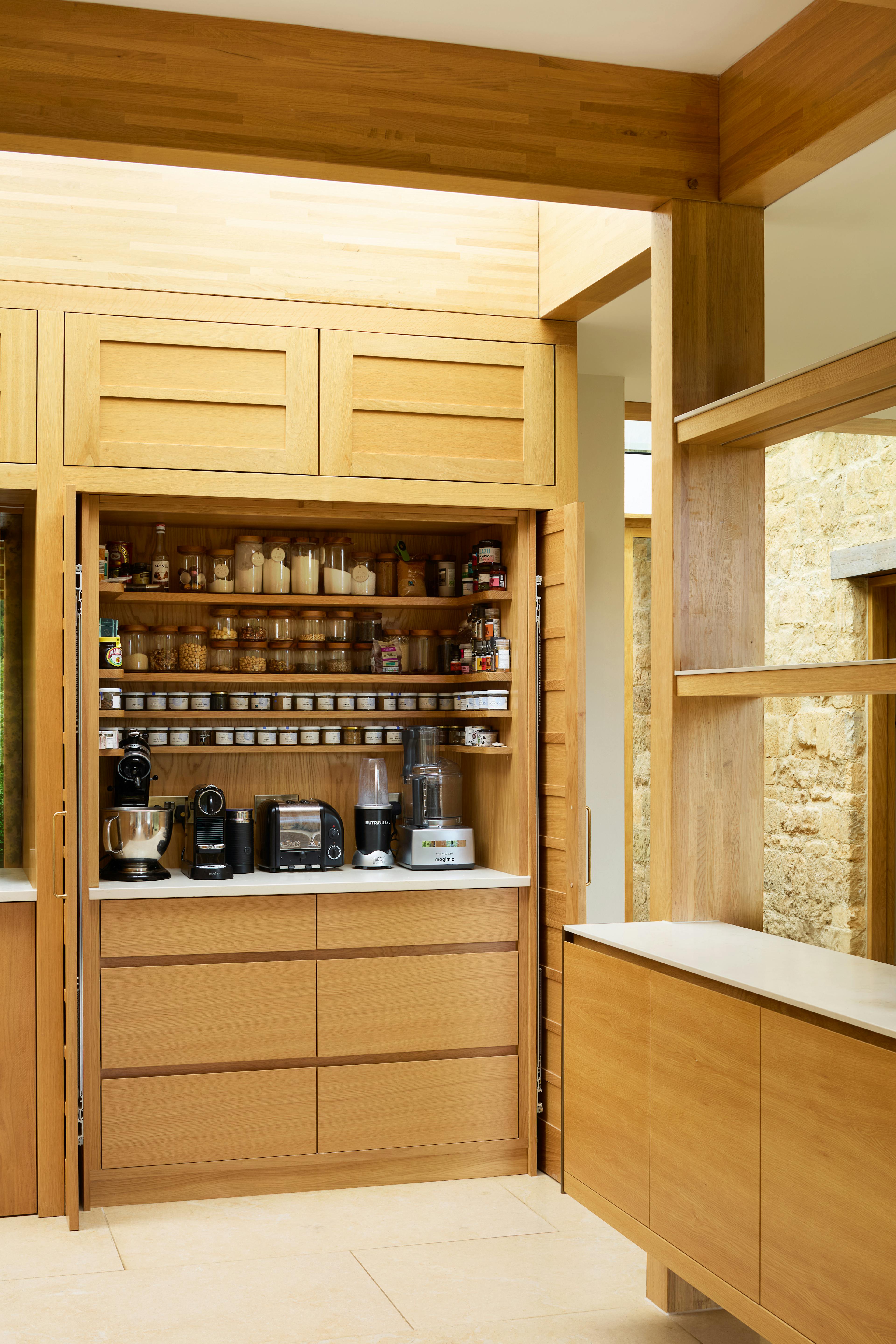 The kitchen of an oak glulam extension to a listed manor house