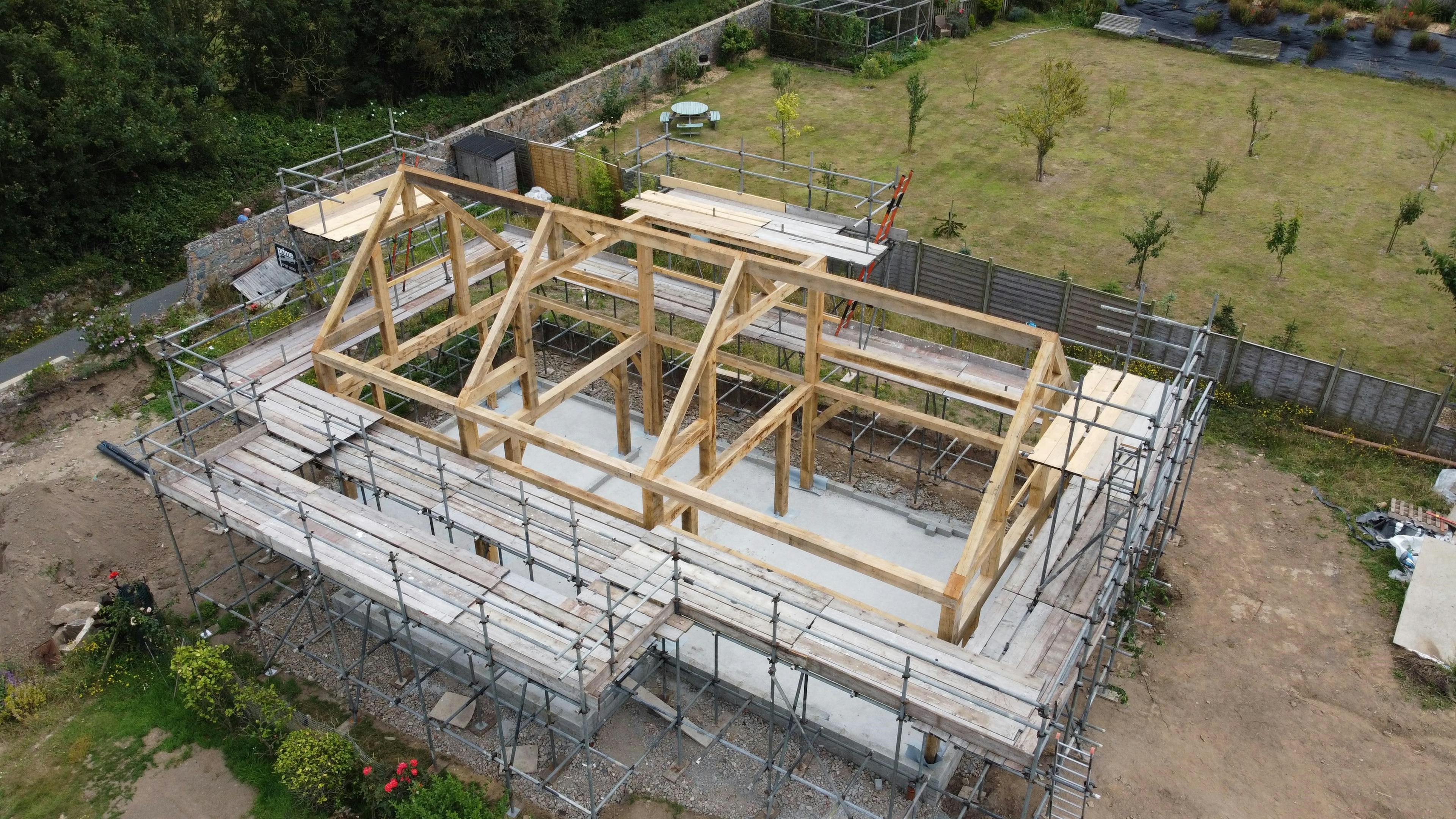 An oak frame during installation on a construction site