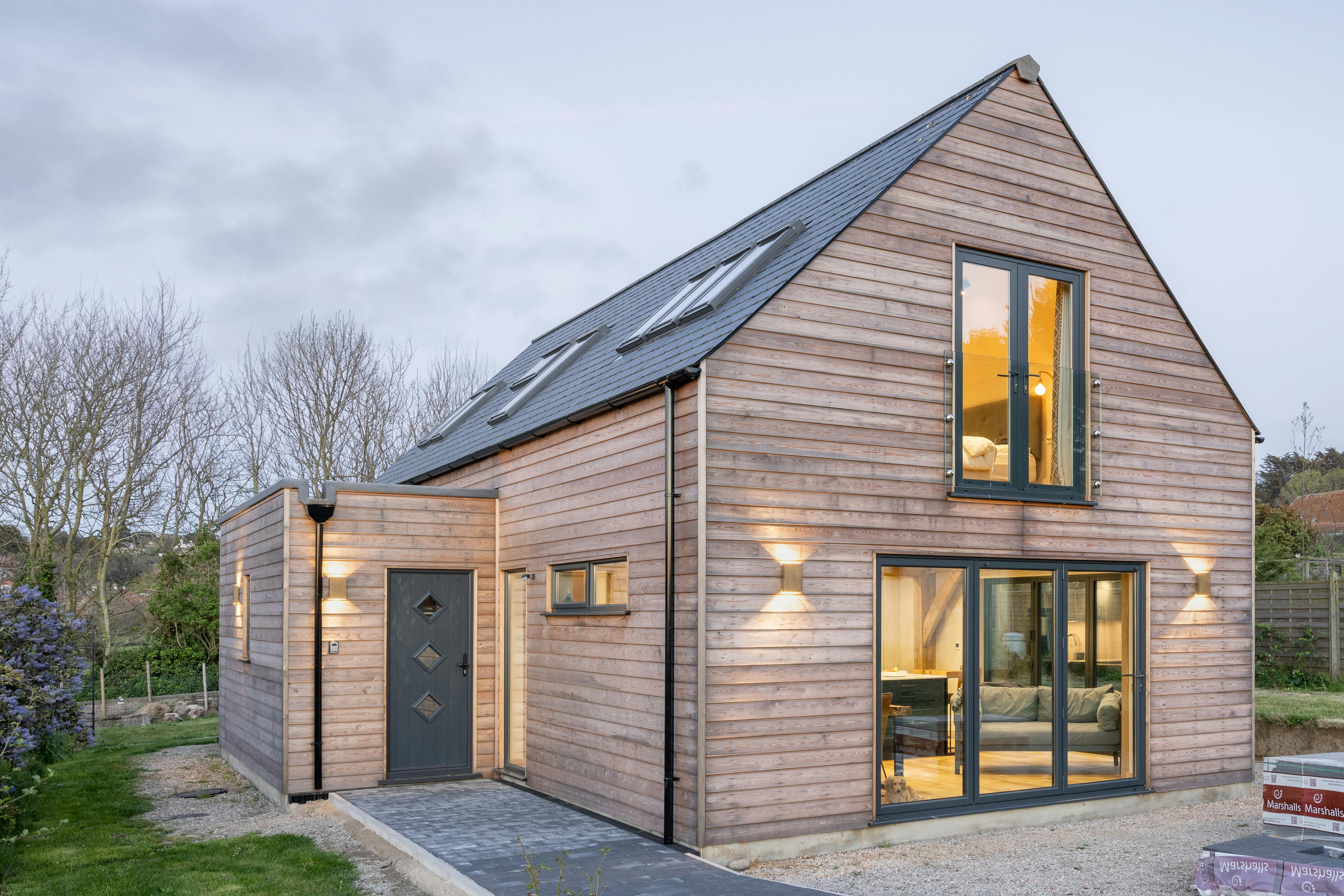 A timber clad two storey oak framed home