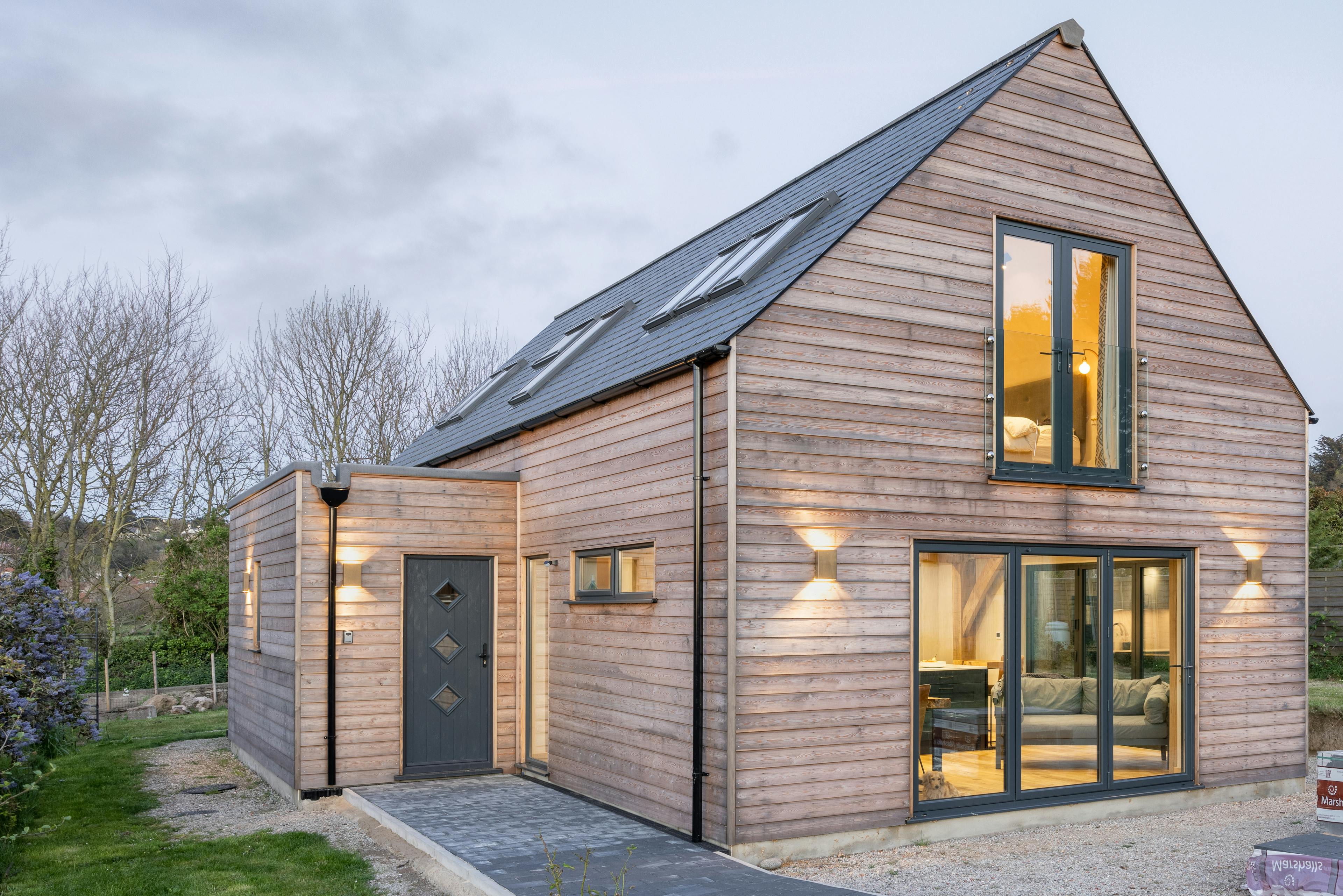 A timber clad two storey oak framed home
