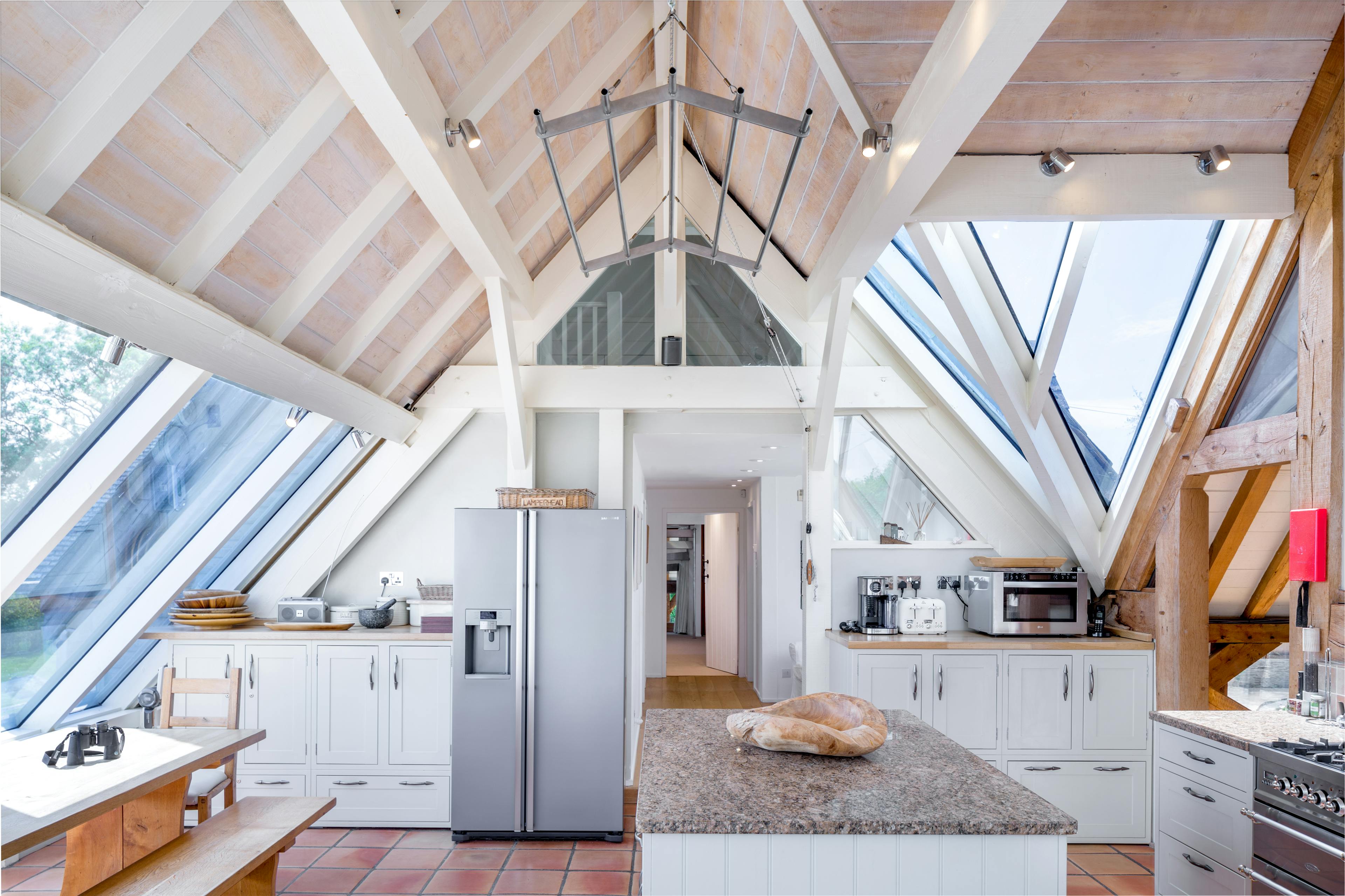 An oak framed kitchen with white painted timber