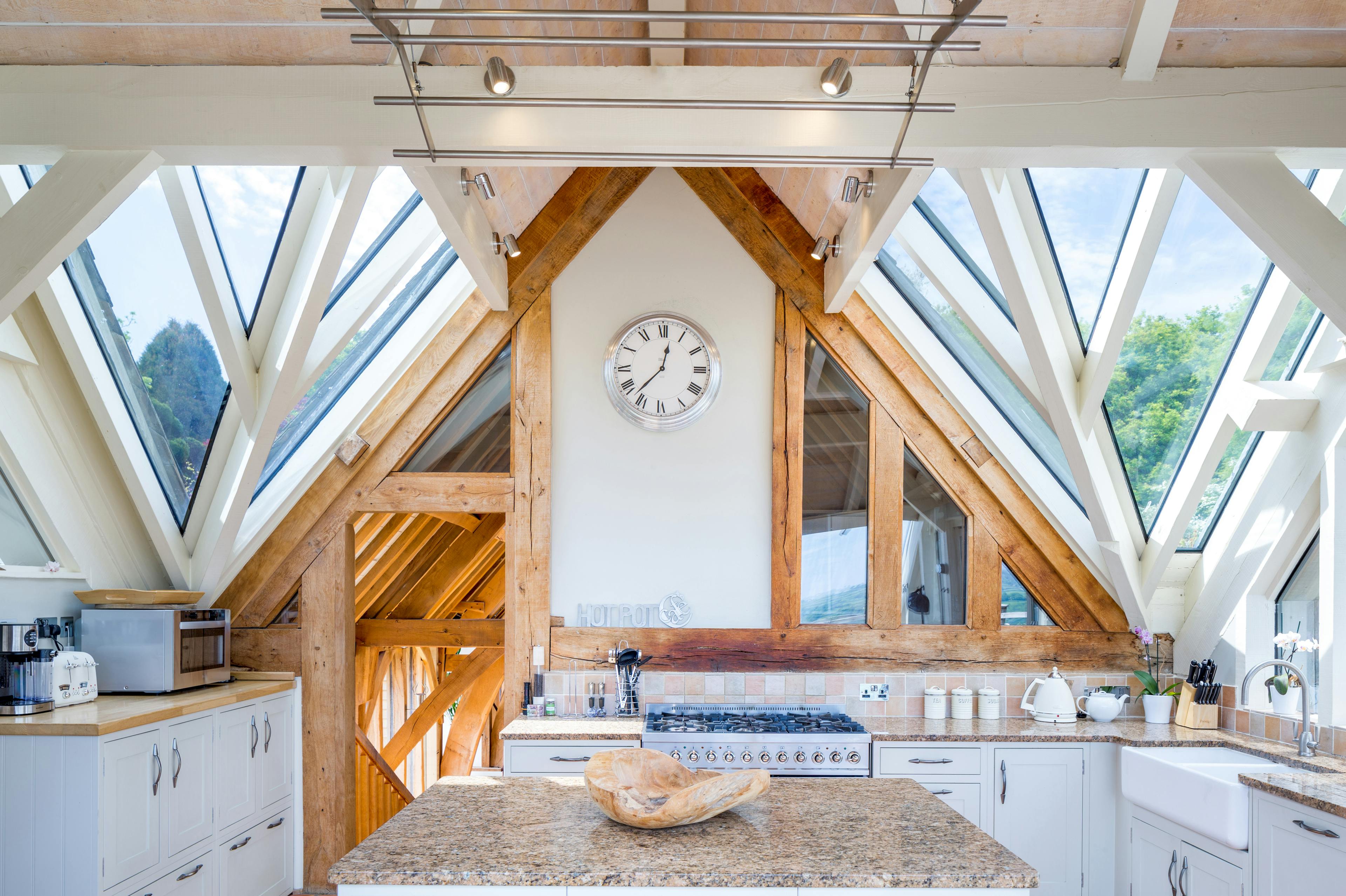 An oak framed kitchen with white painted timber