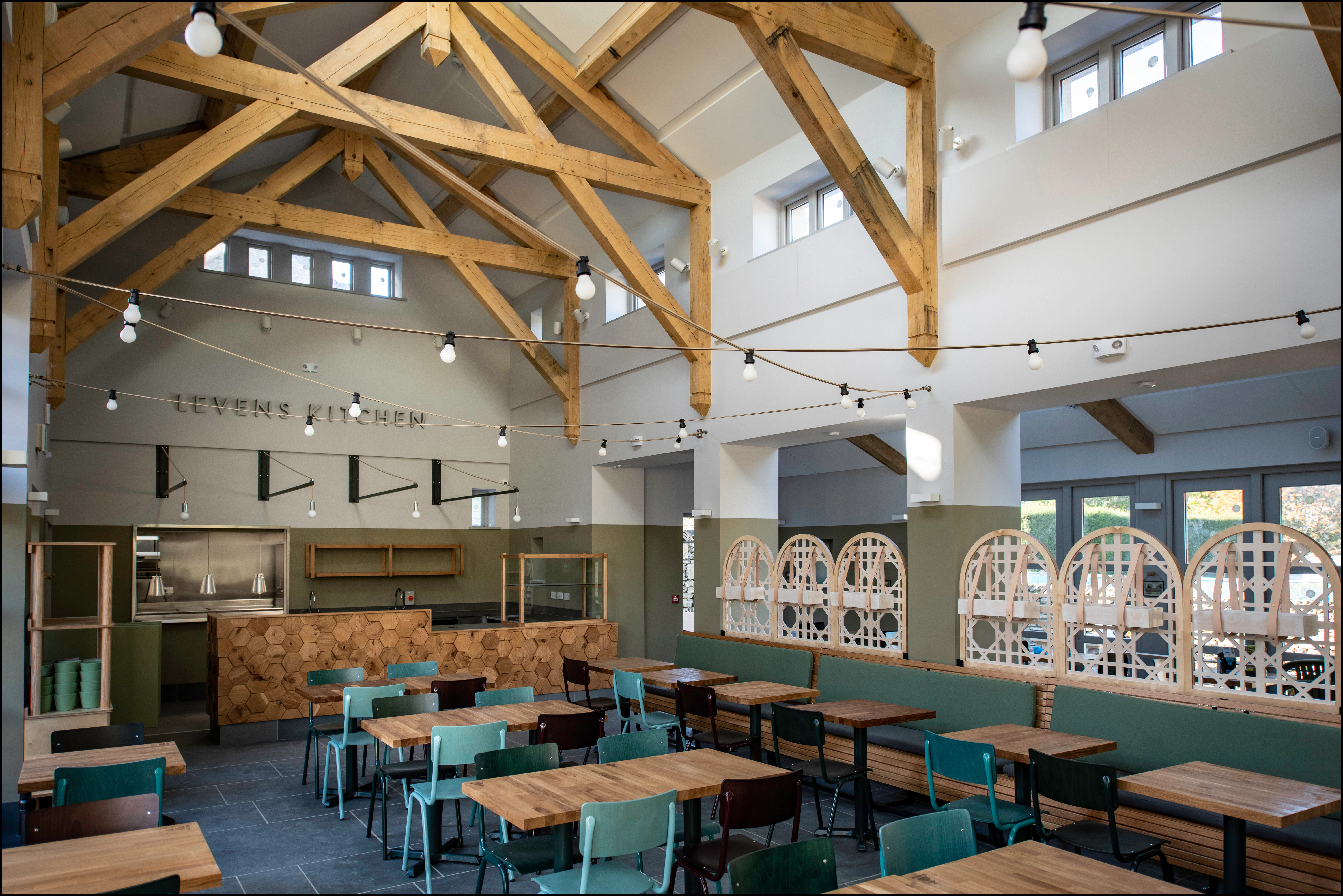 A large oak framed cafe restaurant with high ceilings