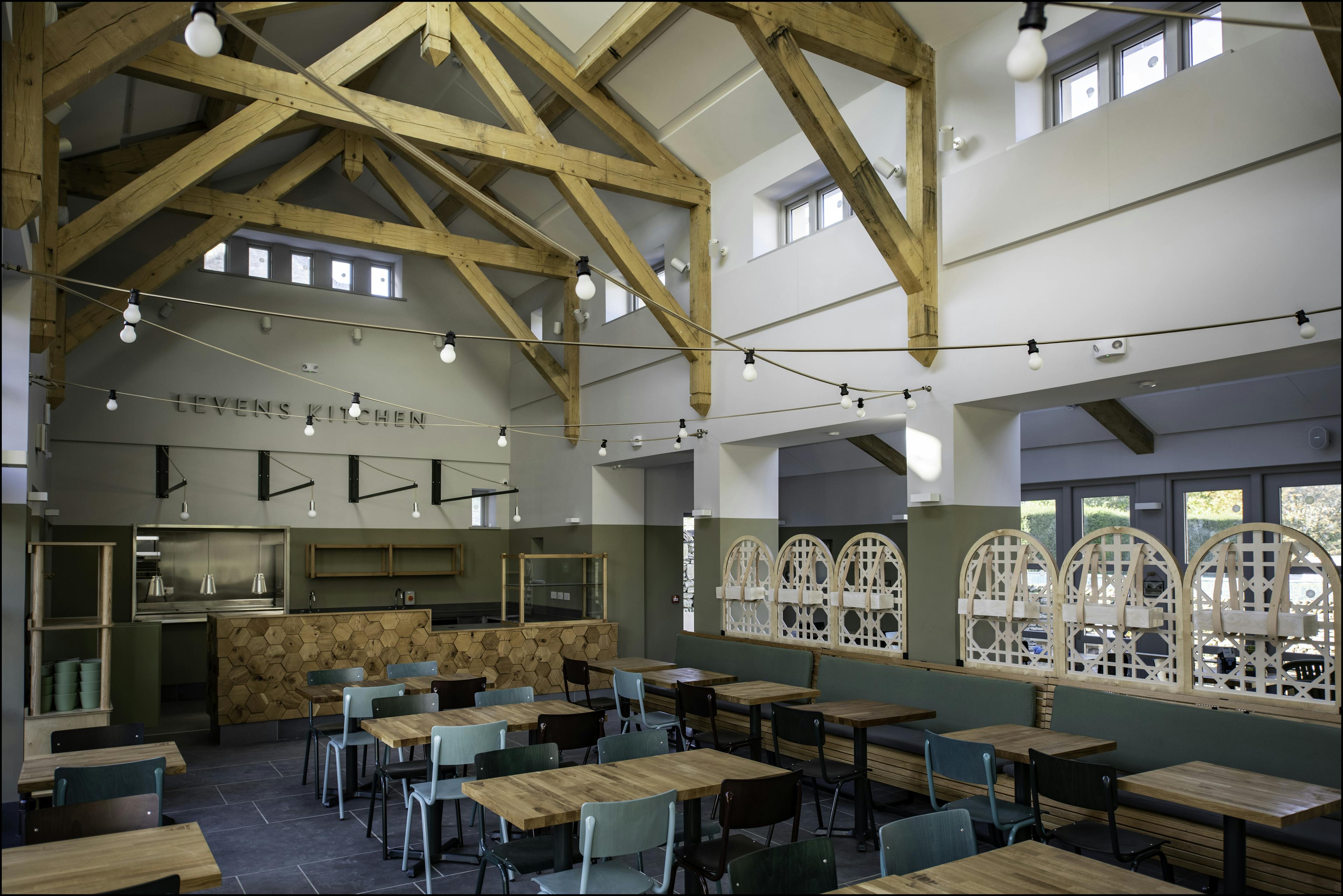 A large oak framed cafe restaurant with high ceilings