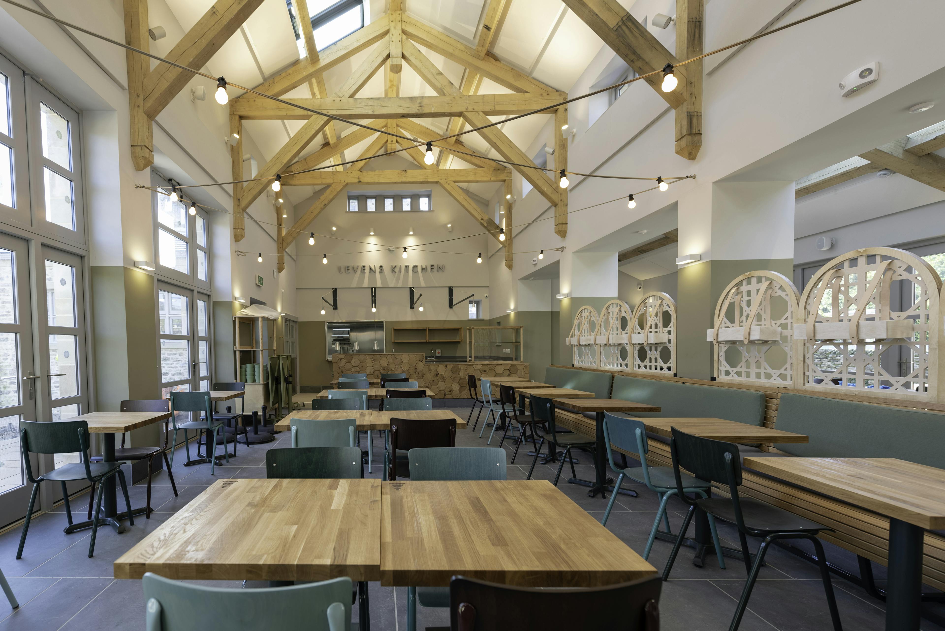 A large oak framed cafe restaurant with high ceilings