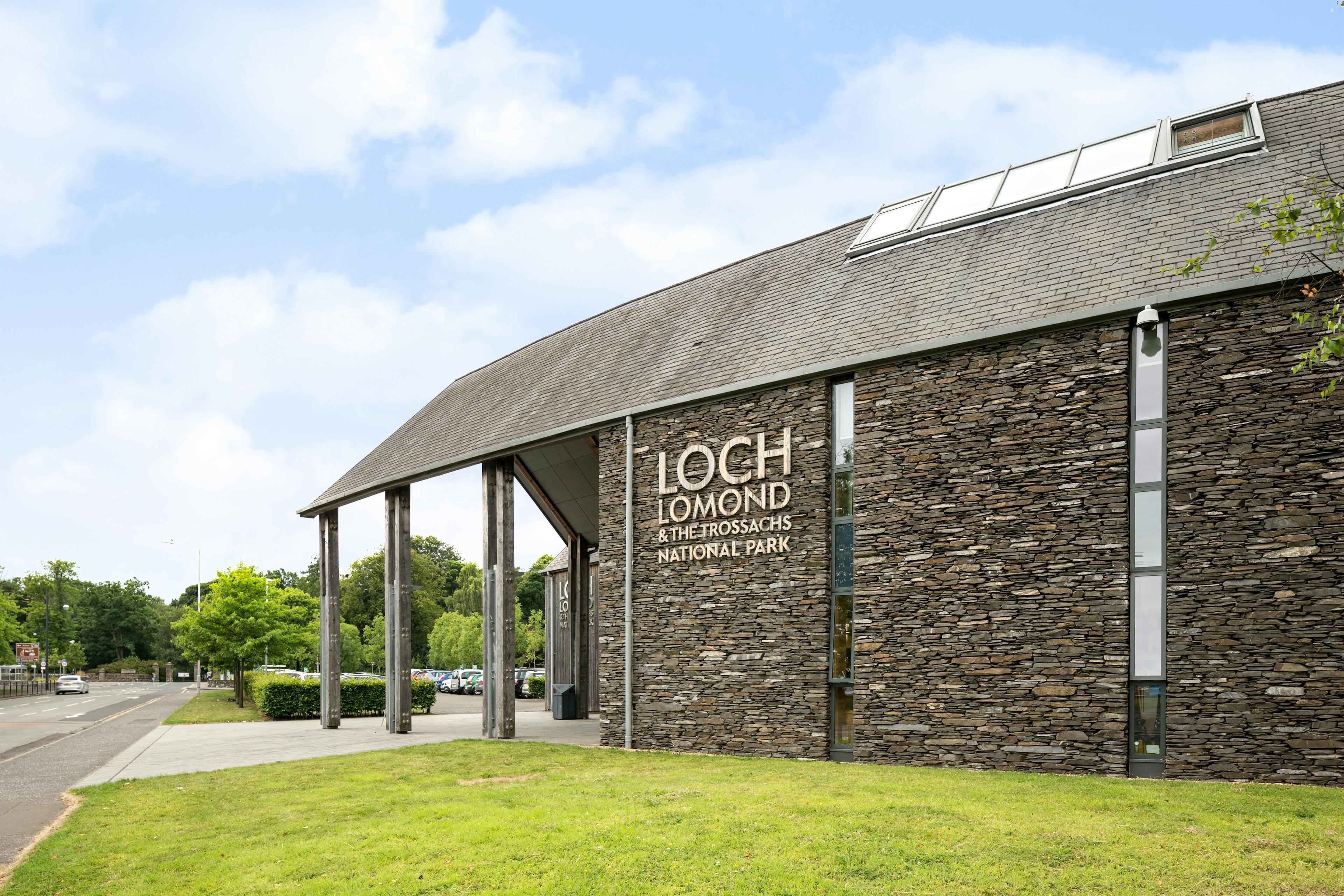 A stone clad large curved building