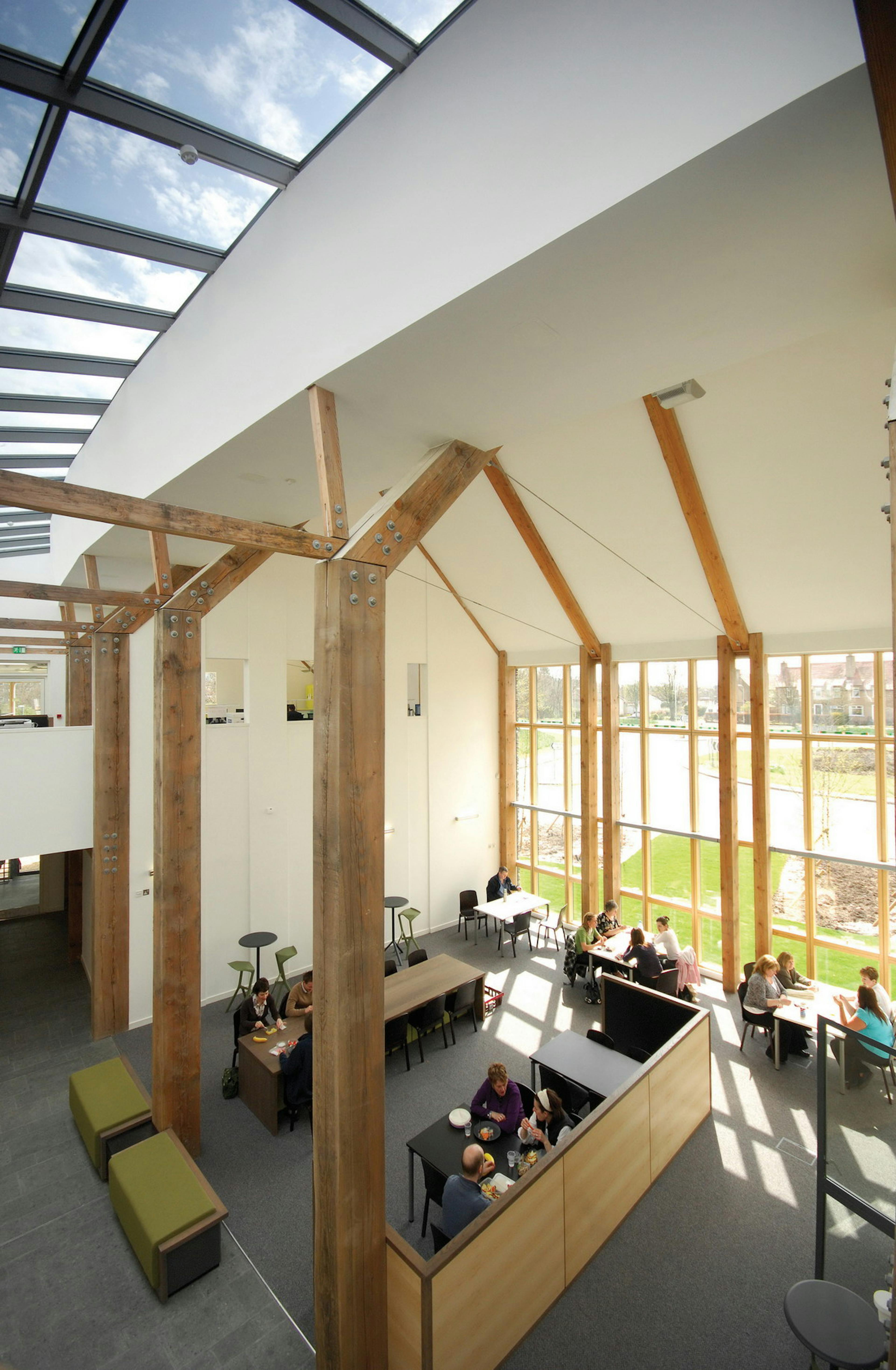Large Douglas fir posts in a large building with rooflights