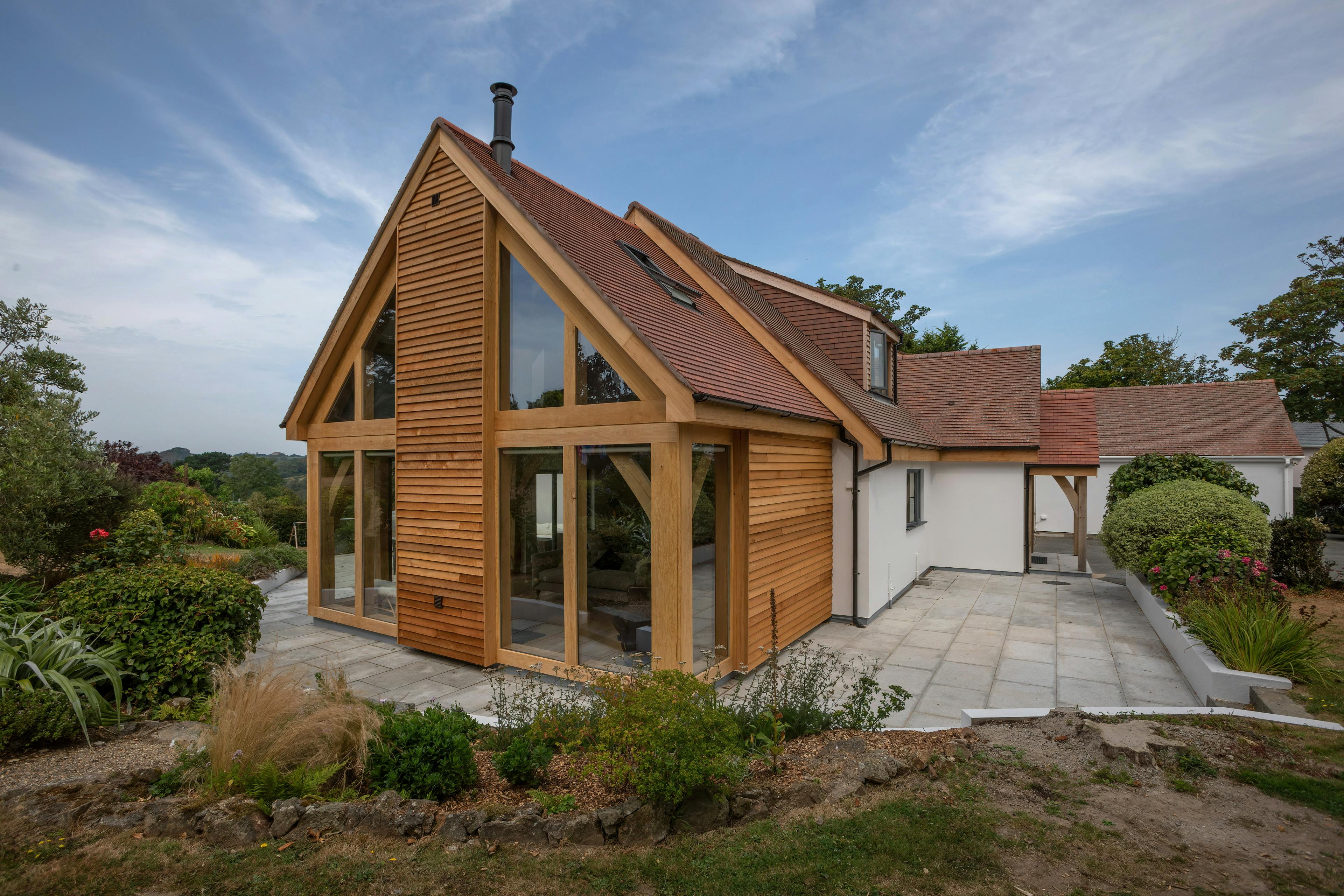 Exterior view of an oak-framed bungalow in Guernsey