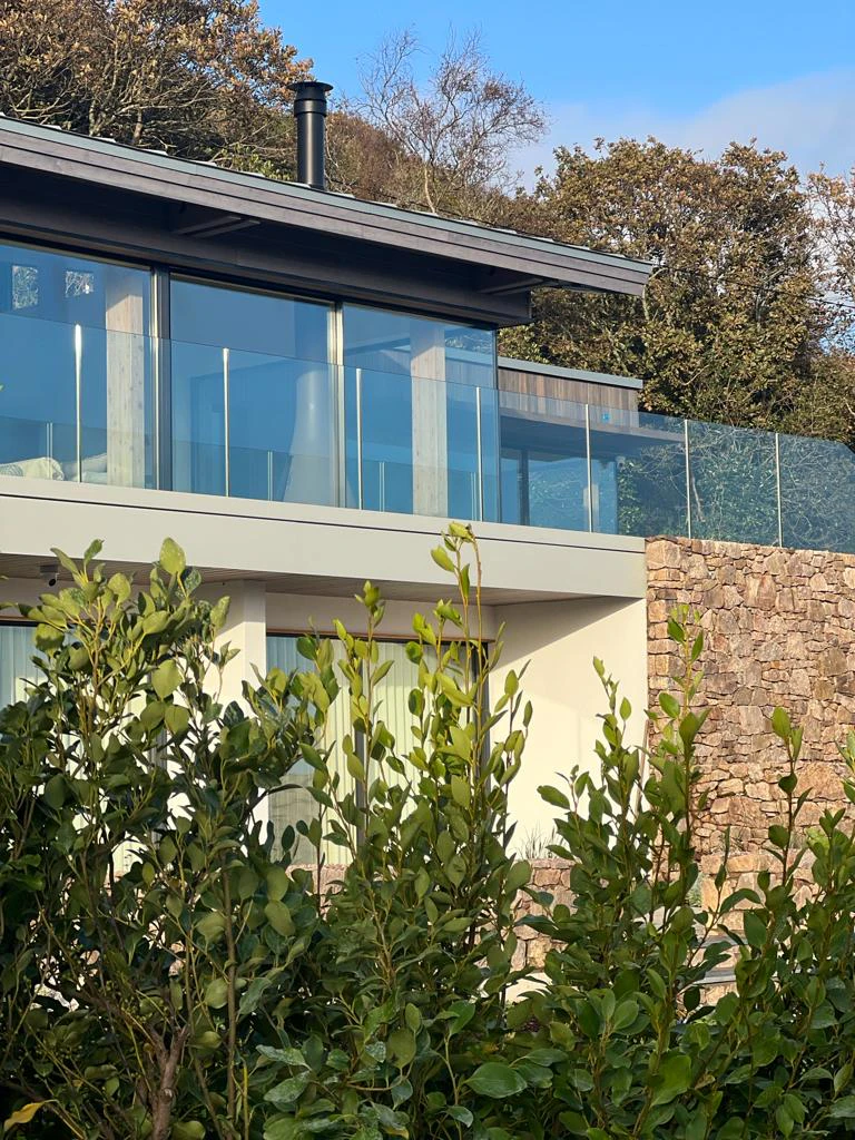 A new build home with a glazed balcony
