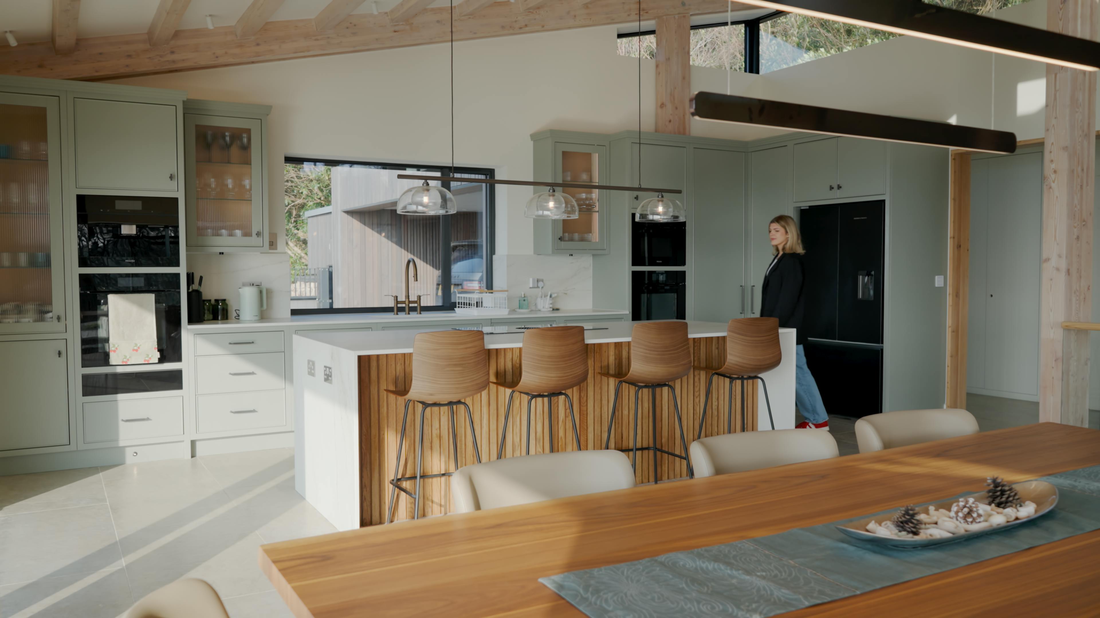 An oak glulam open plan living room with dining and kitchen area