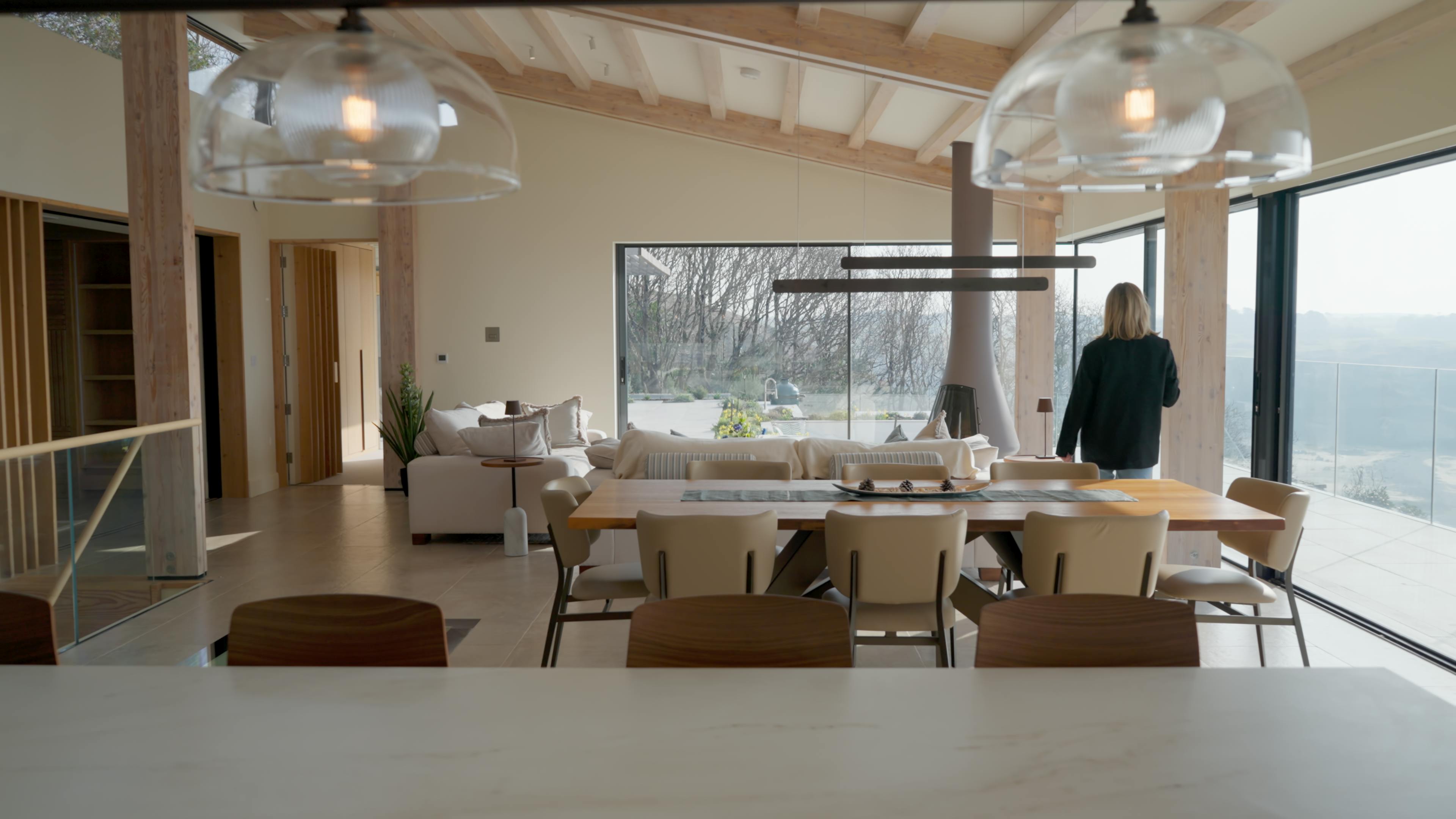 An oak glulam open plan living room with dining and lounge area