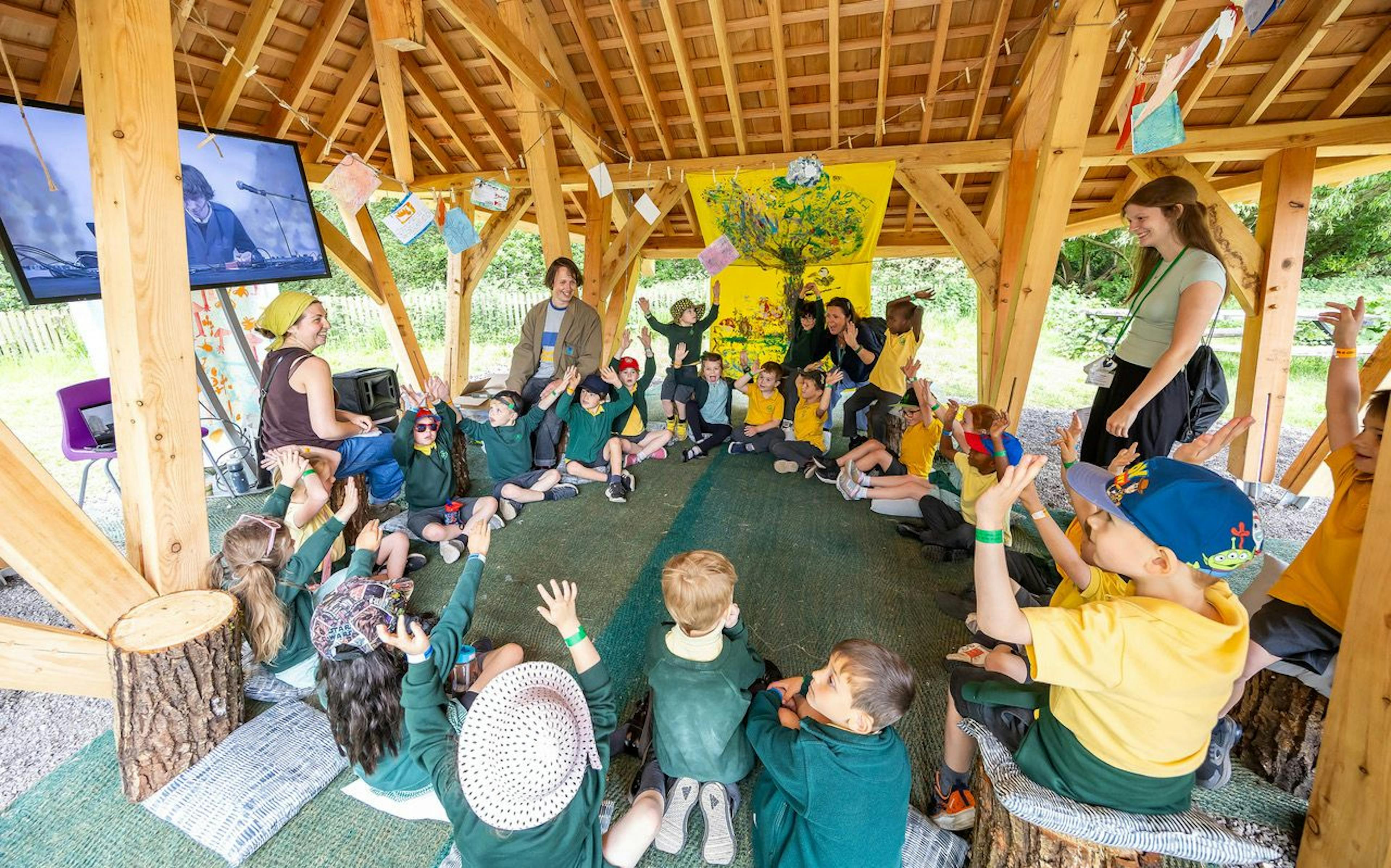 Children enjoying a timber structured outdoor classroom