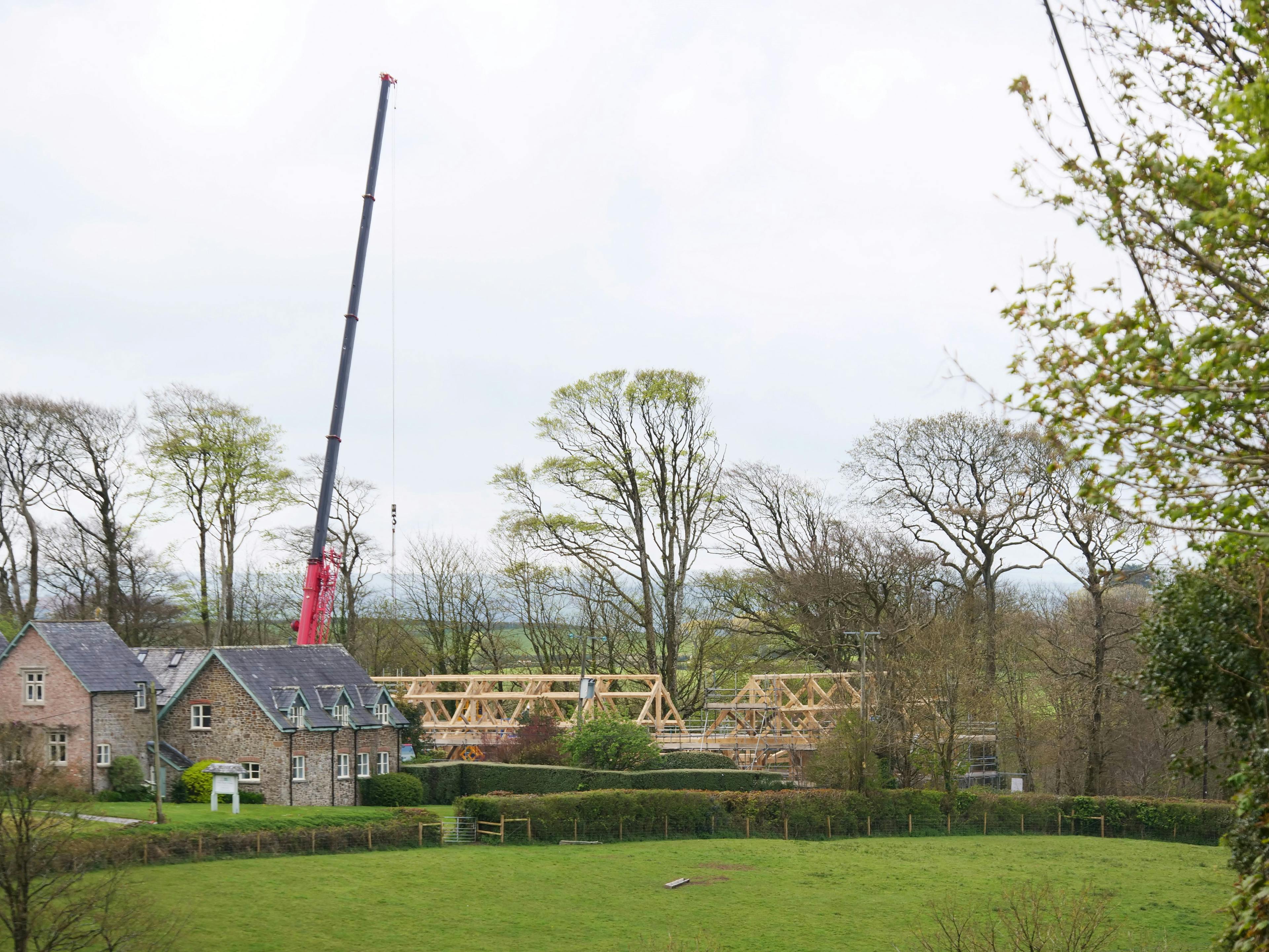 An oak frame for a wedding barn during installation