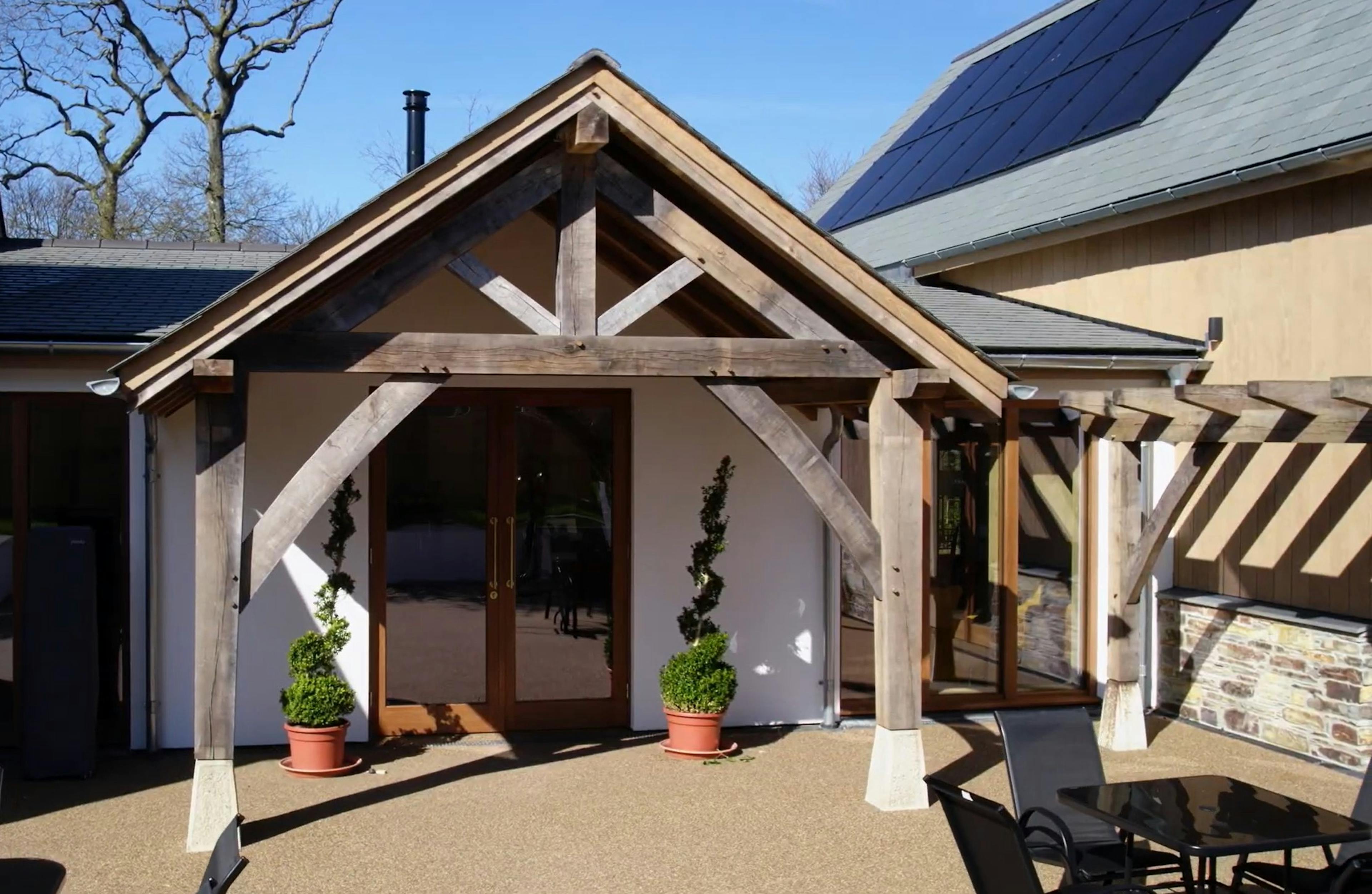 An oak frame porch on the front of an oak frame wedding barn