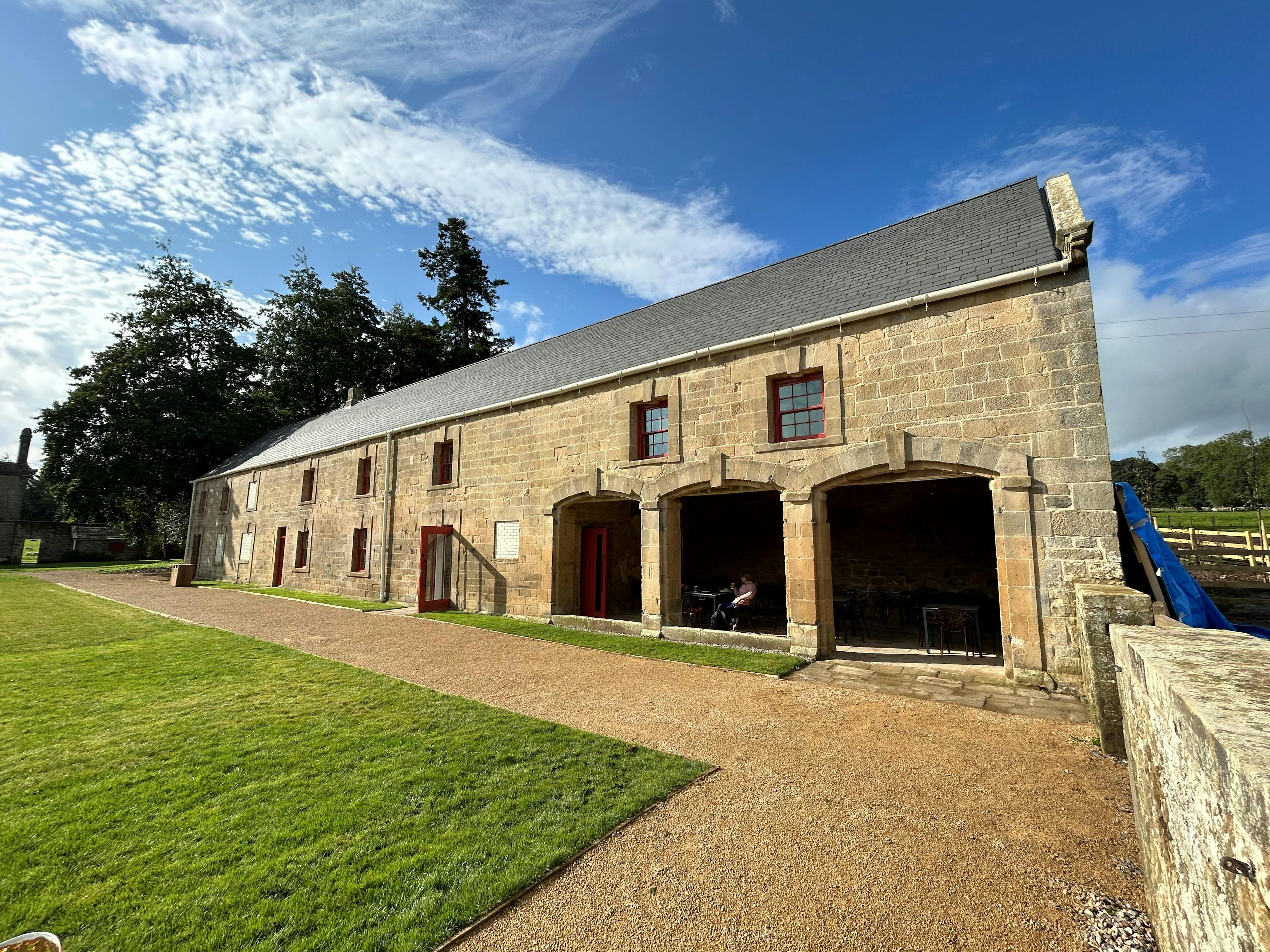 A renovated coach house to create a new cafe for visitors to Belsay Hall