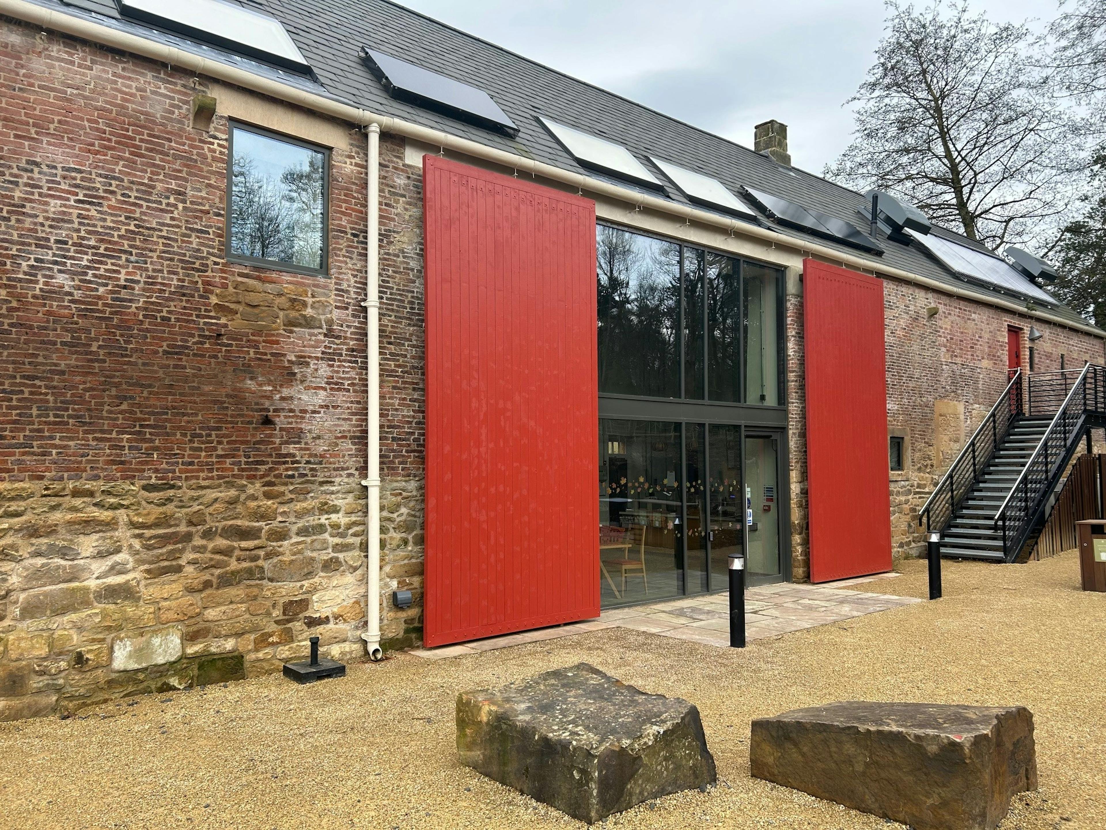 A renovated coach house to create a new cafe for visitors to Belsay Hall