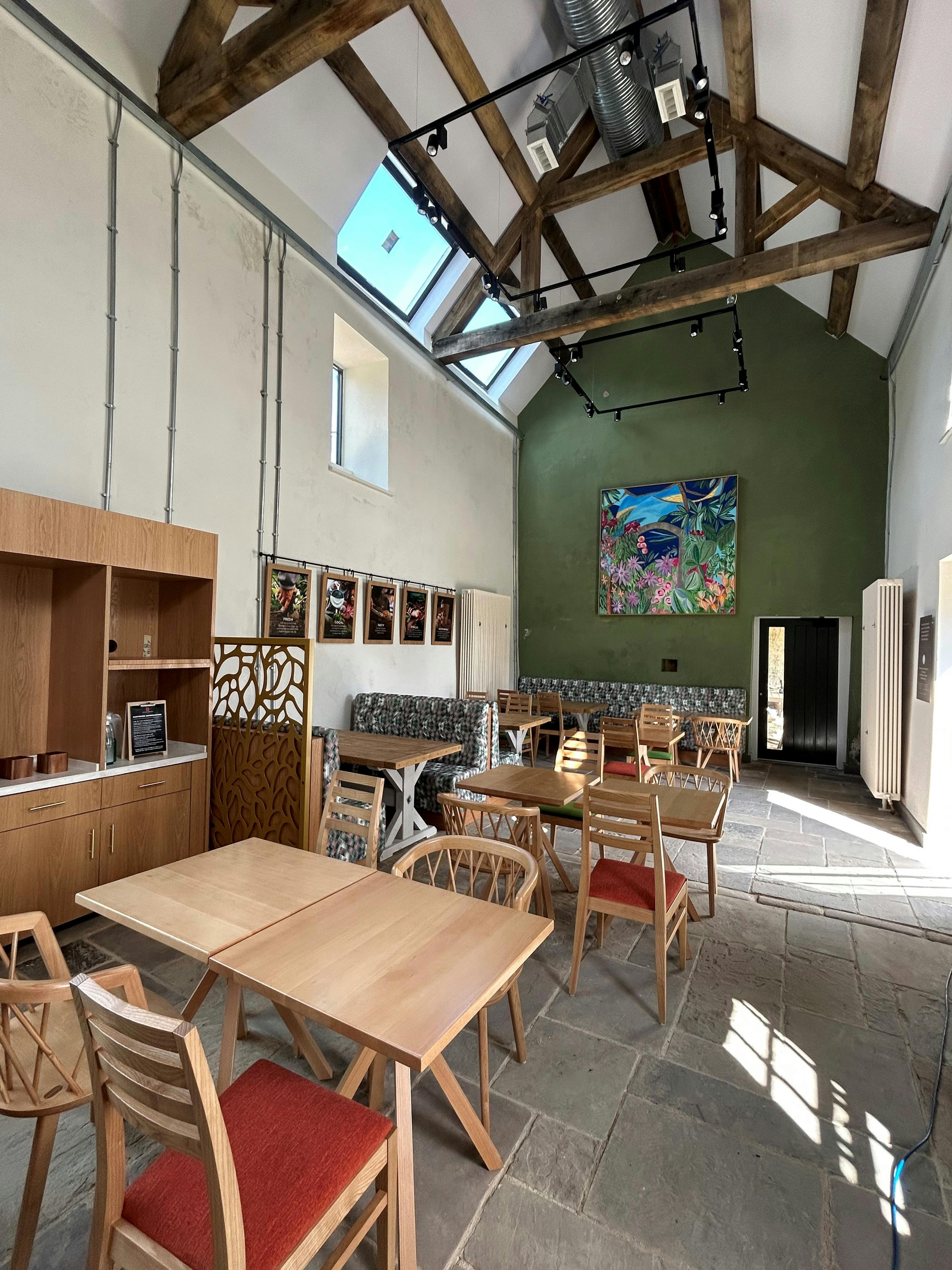 Oak trusses in a renovated coach house to create a new cafe for visitors to Belsay Hall