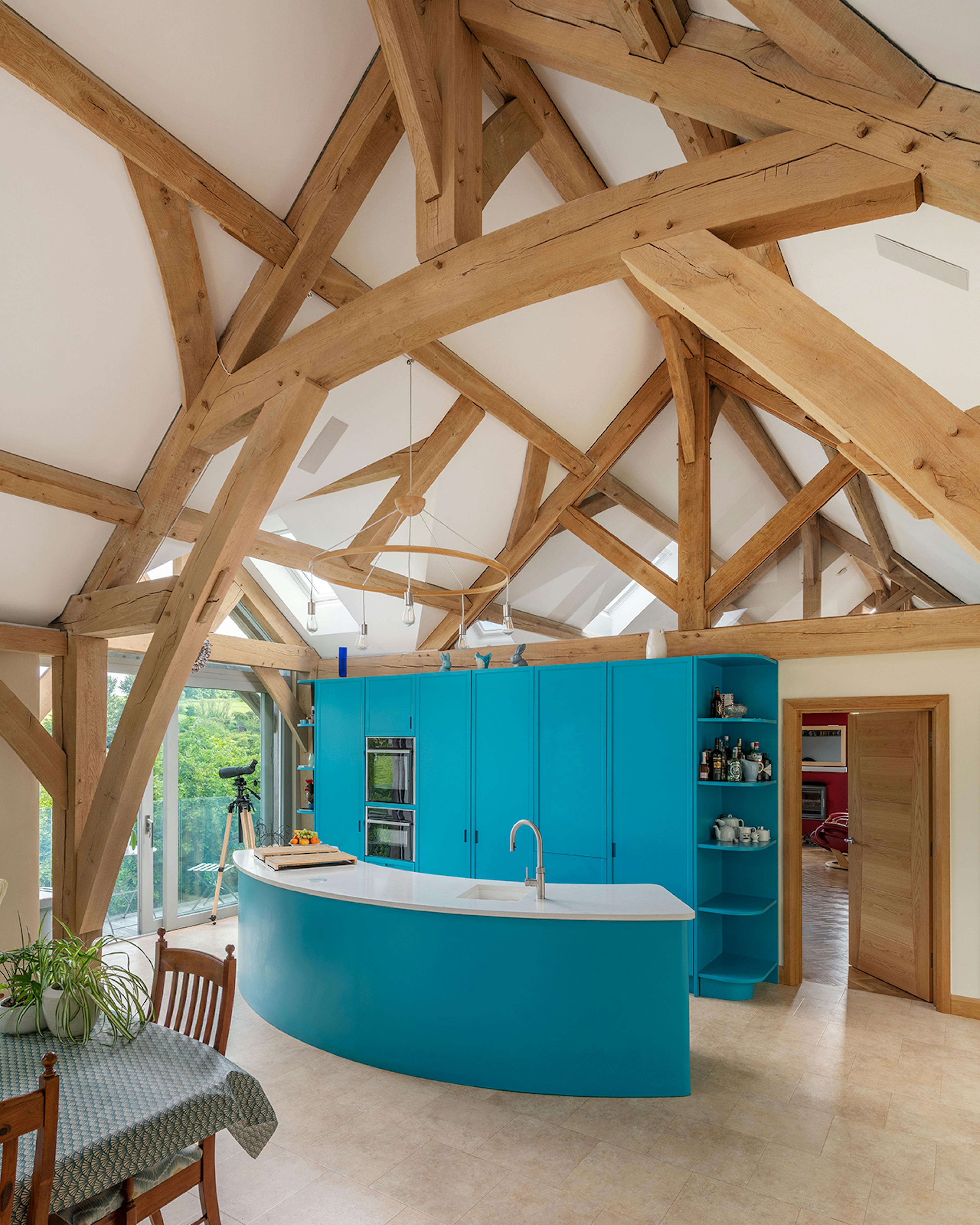 A vaulted ceiling in an oak framed open plan kitchen and dining room