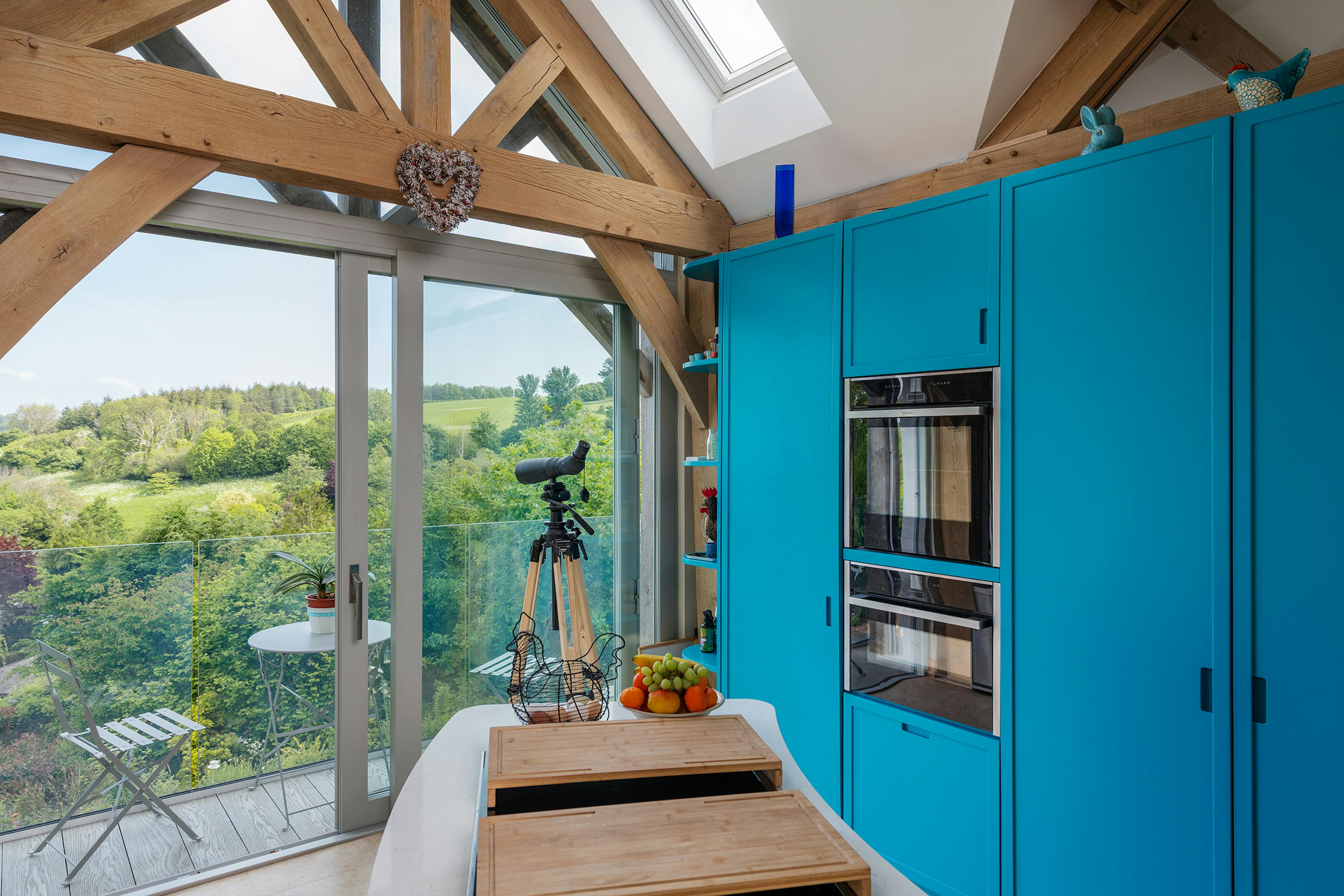 A vaulted ceiling in an oak framed kitchen with views of the estuary