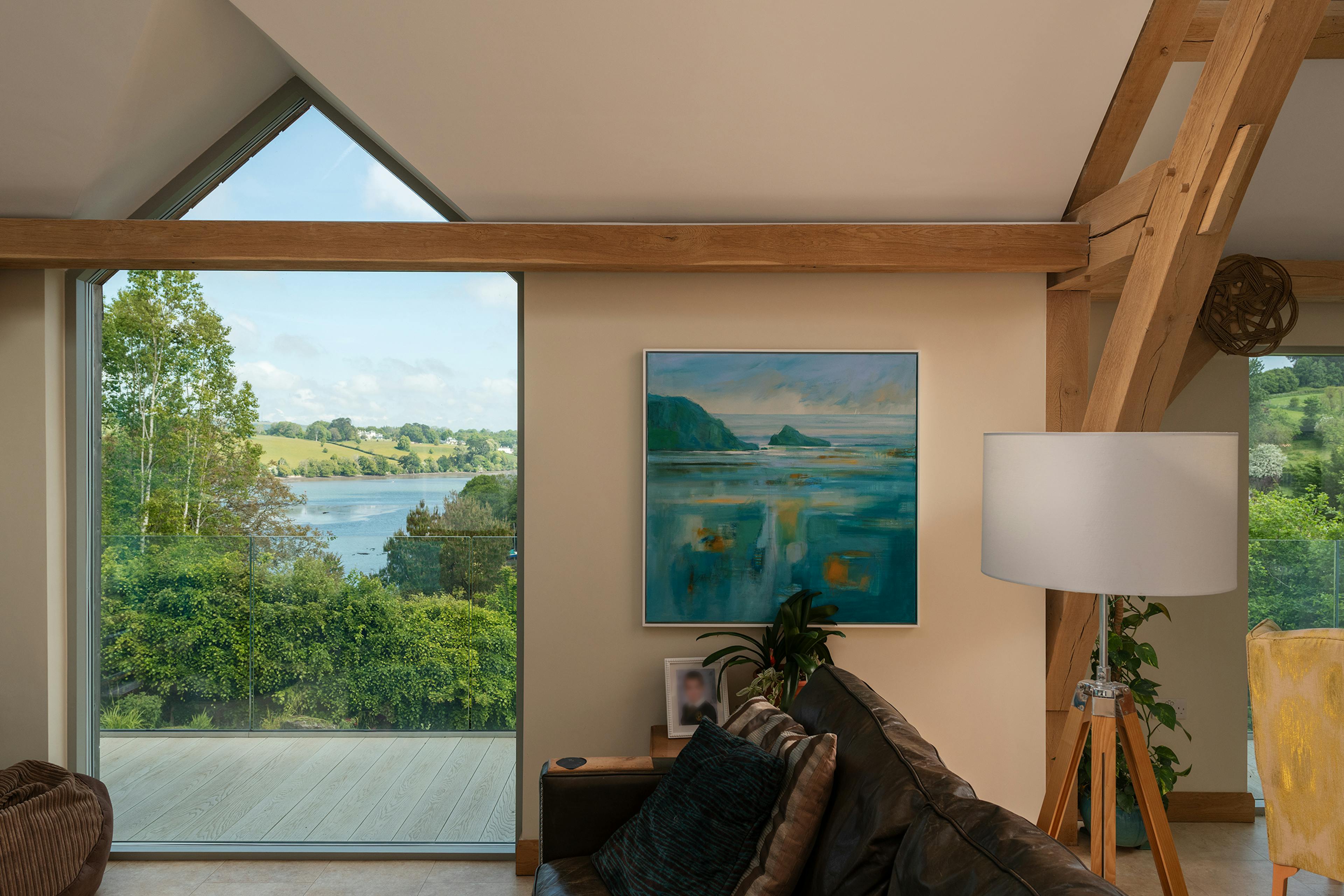 An oak framed living room with views of the estuary