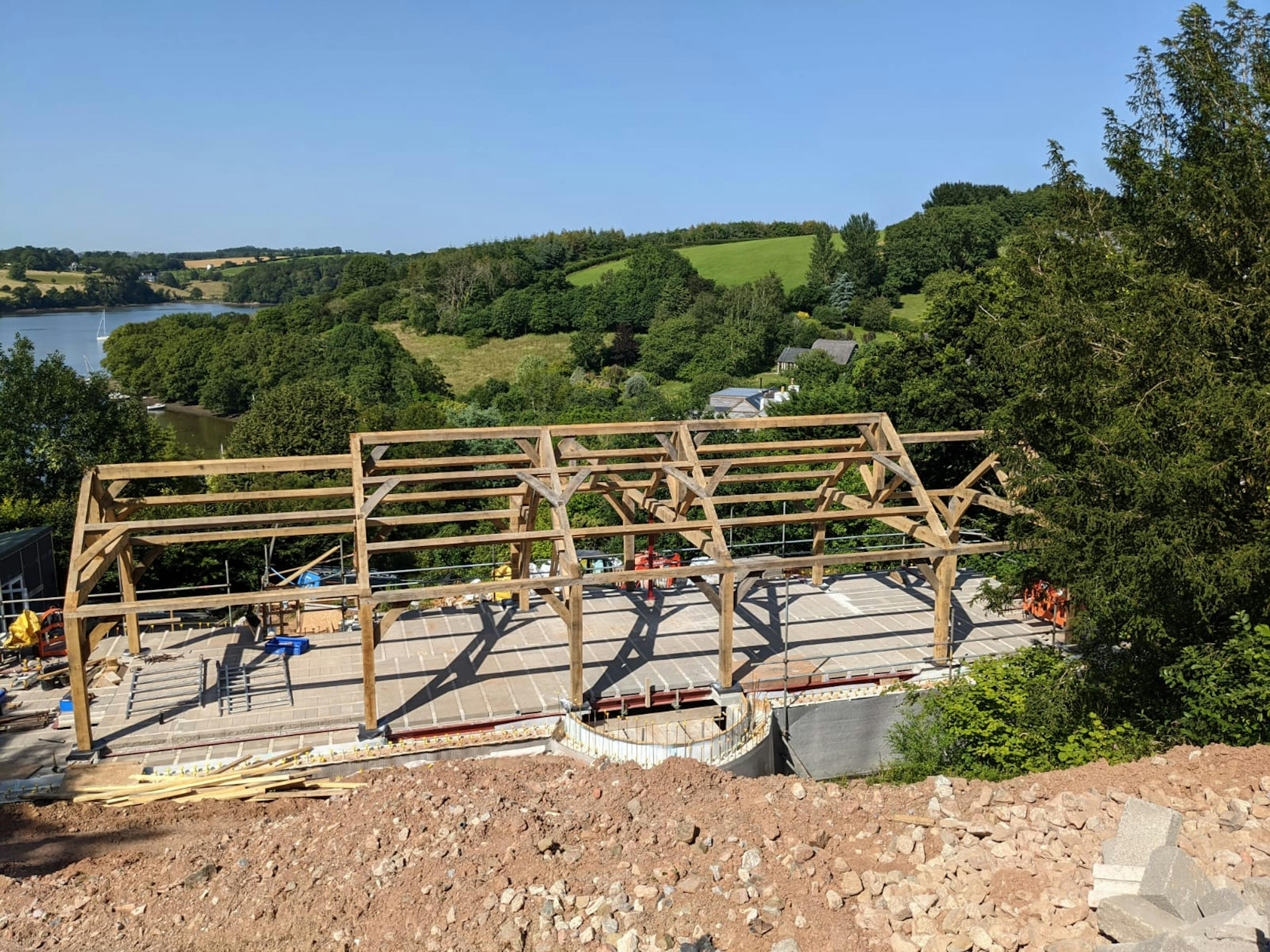 Installation of an oak frame home with views of an estuary
