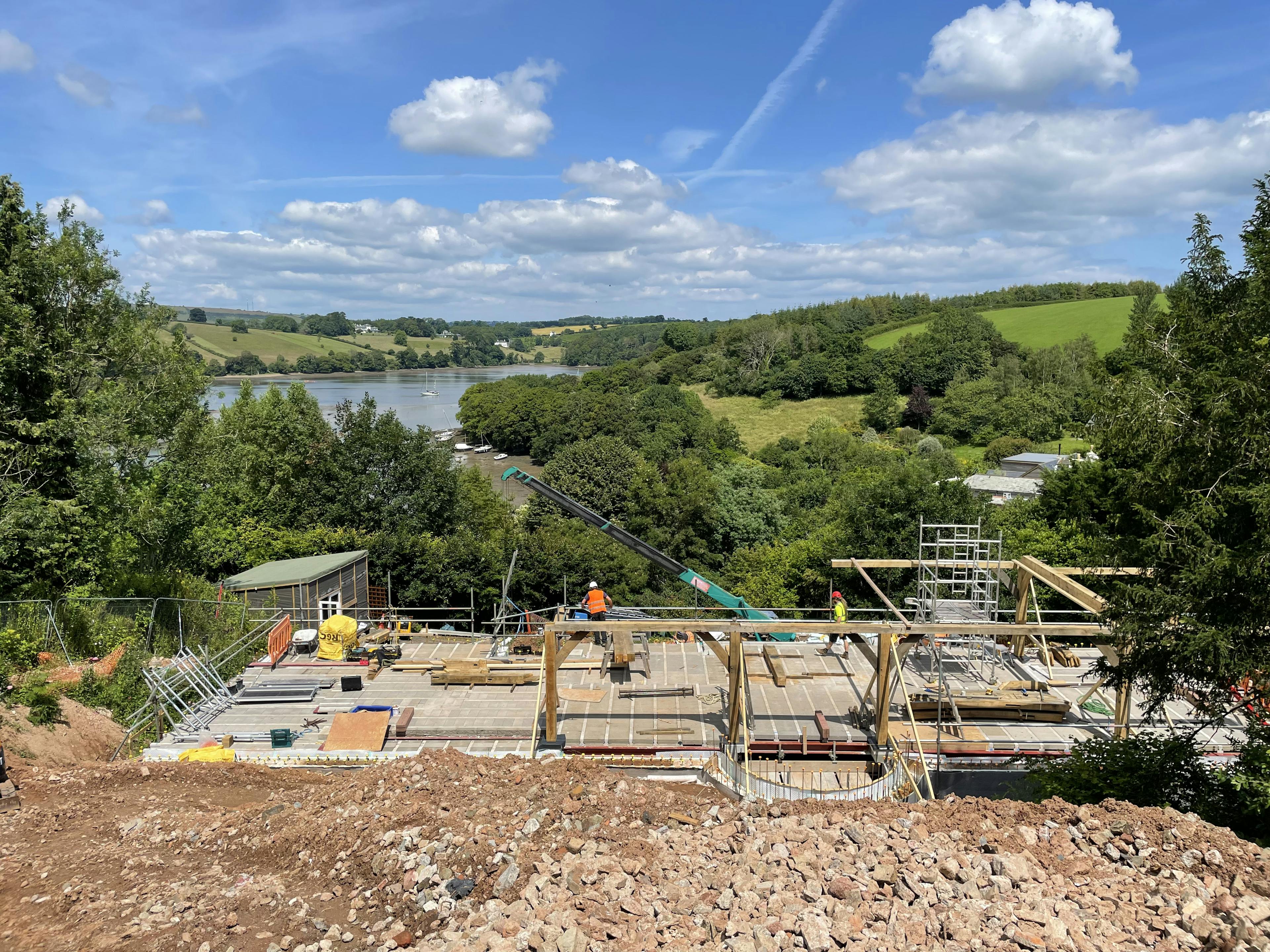 Installation of an oak frame home with views of an estuary