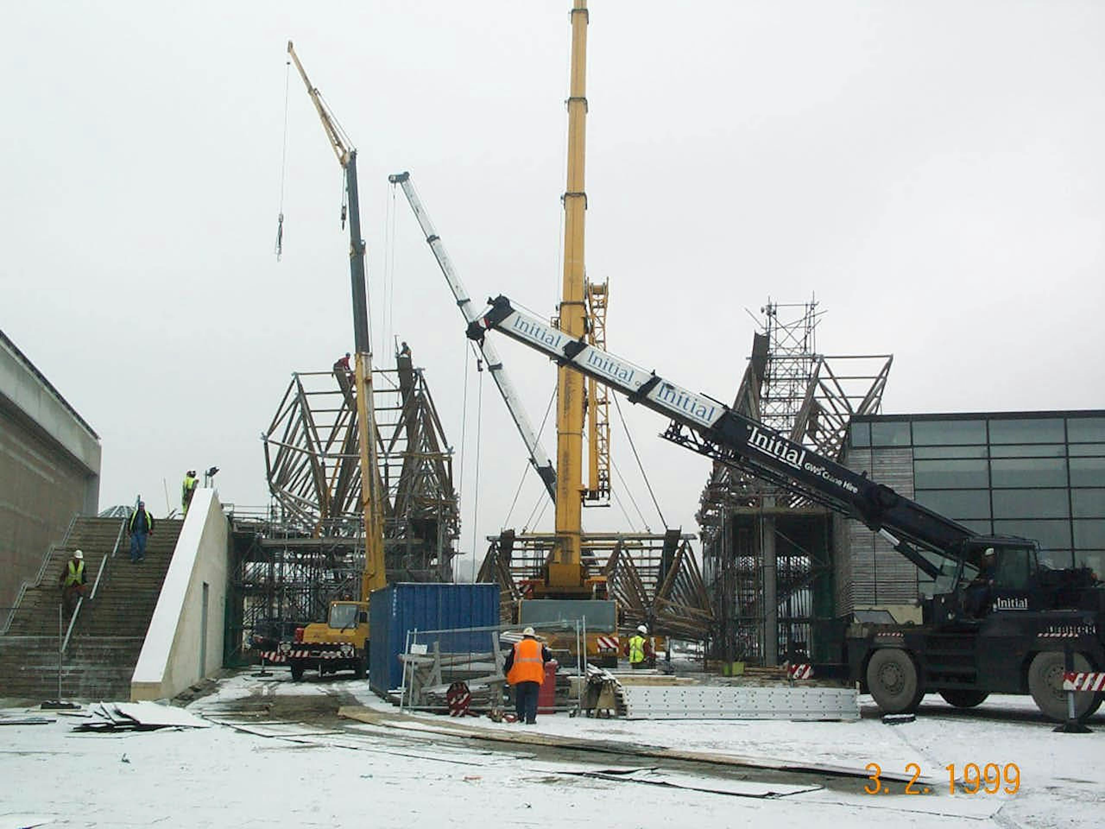 Snow-covered construction site with crane assembling solar canopy at Doncaster’s Earth Centre