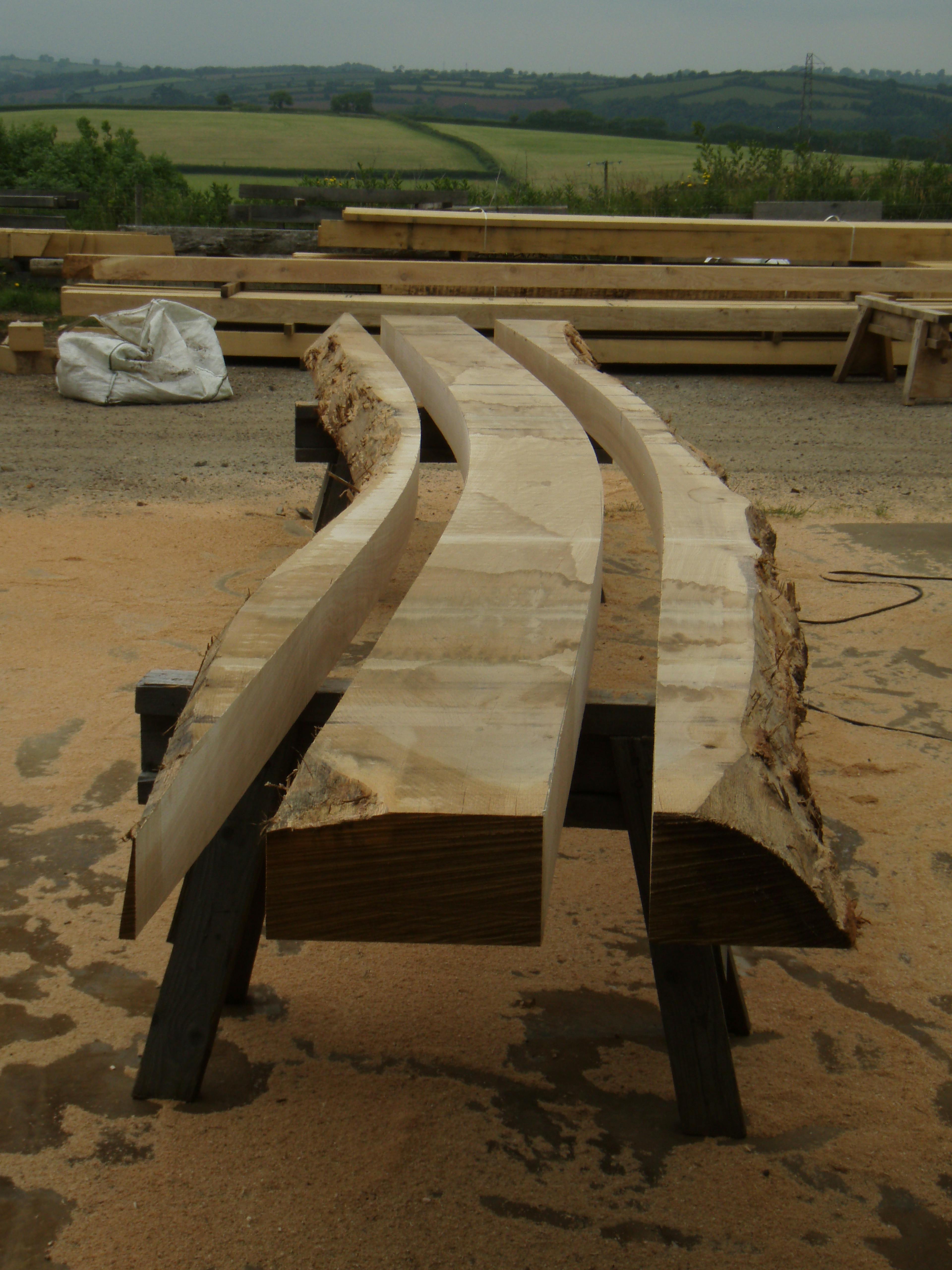 Oak post and cruck frame under assembly in a workshop, showing traditional timber construction techniques for the Penistone Market project