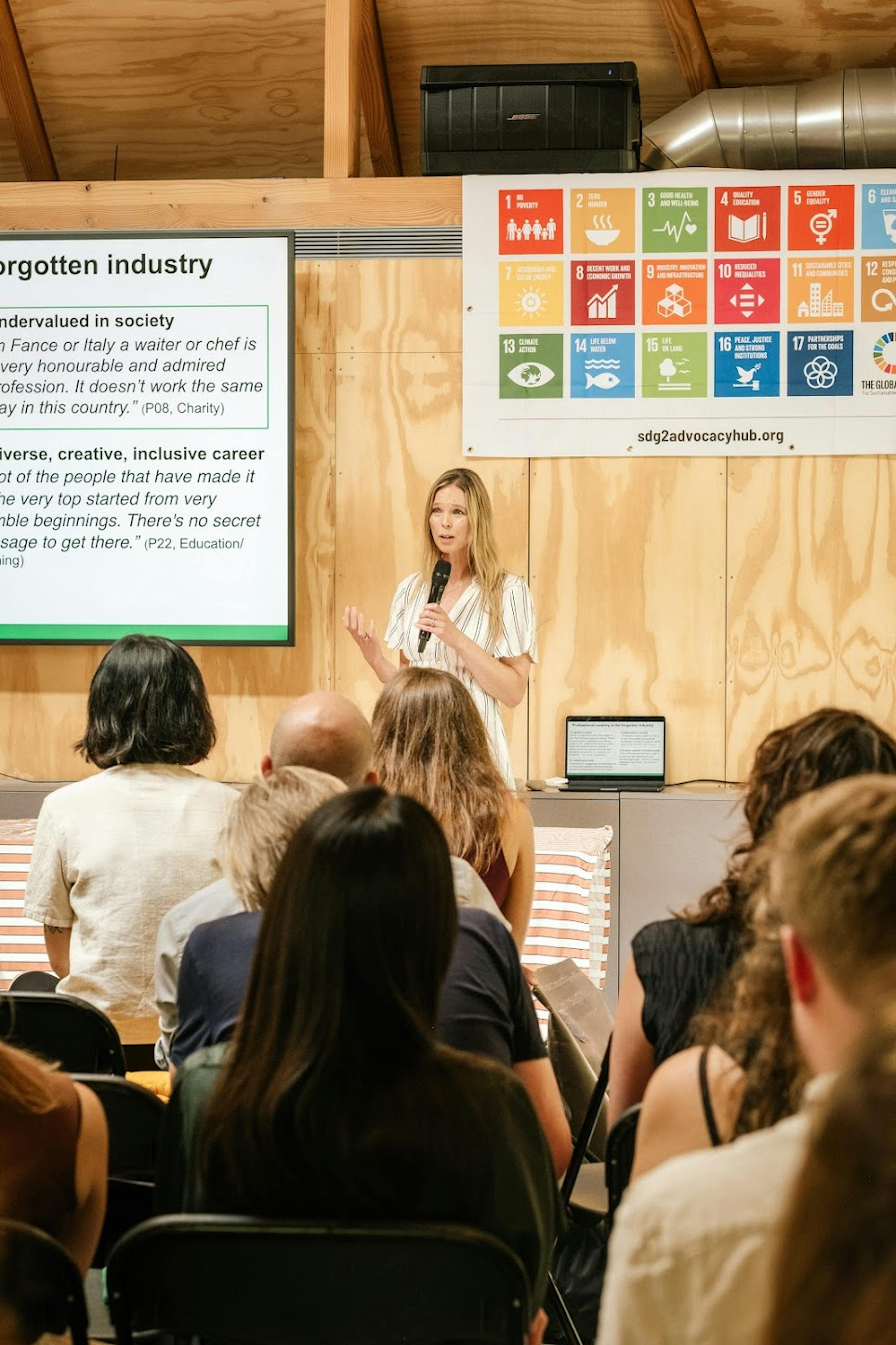 Interior of a workshop venue featuring Douglas fir timber framing, arranged for a presentation
