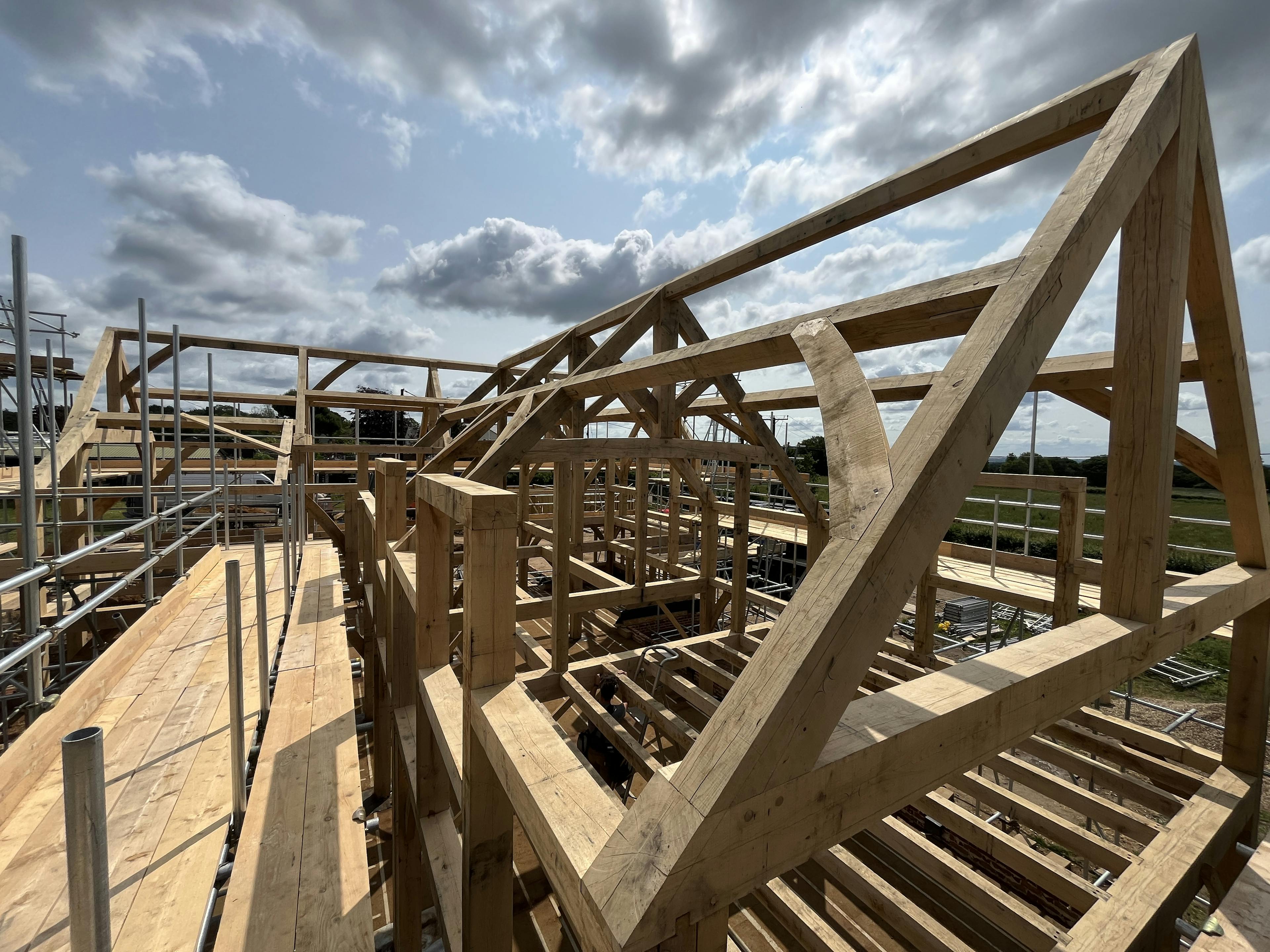 The roof line of an oak frame home during construction
