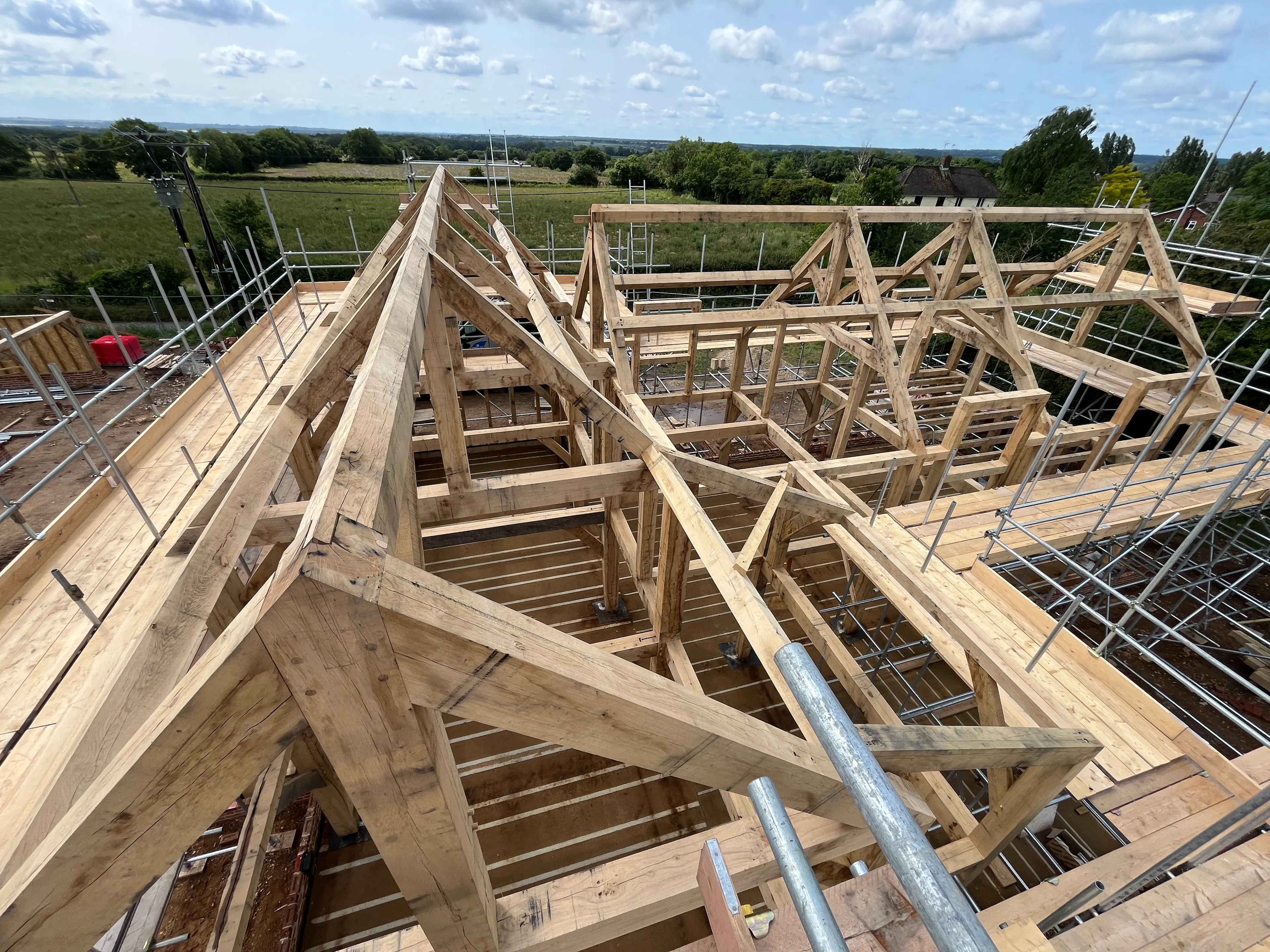 The roof line of an oak frame home during construction