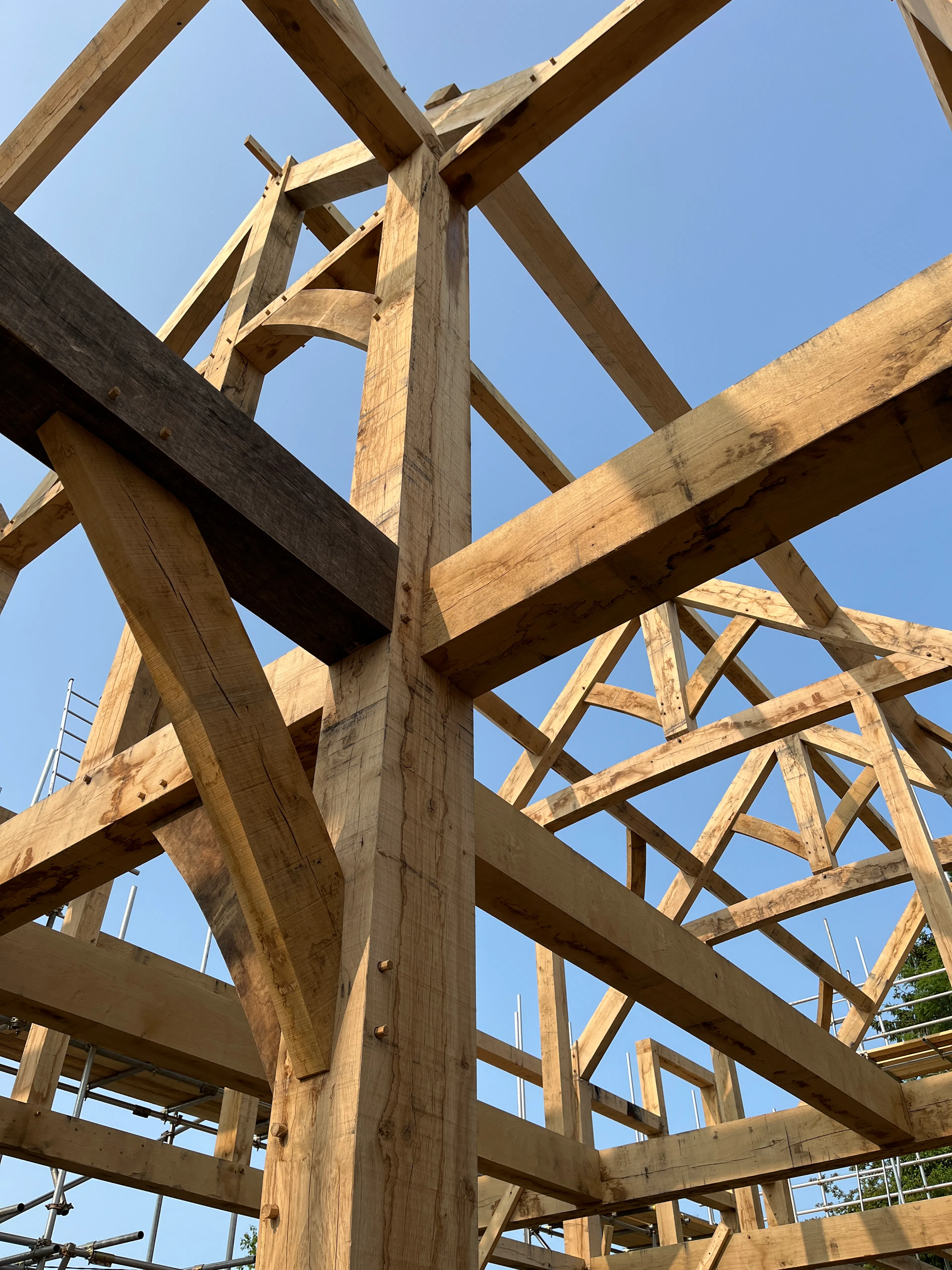A close up of an oak frame home during construction