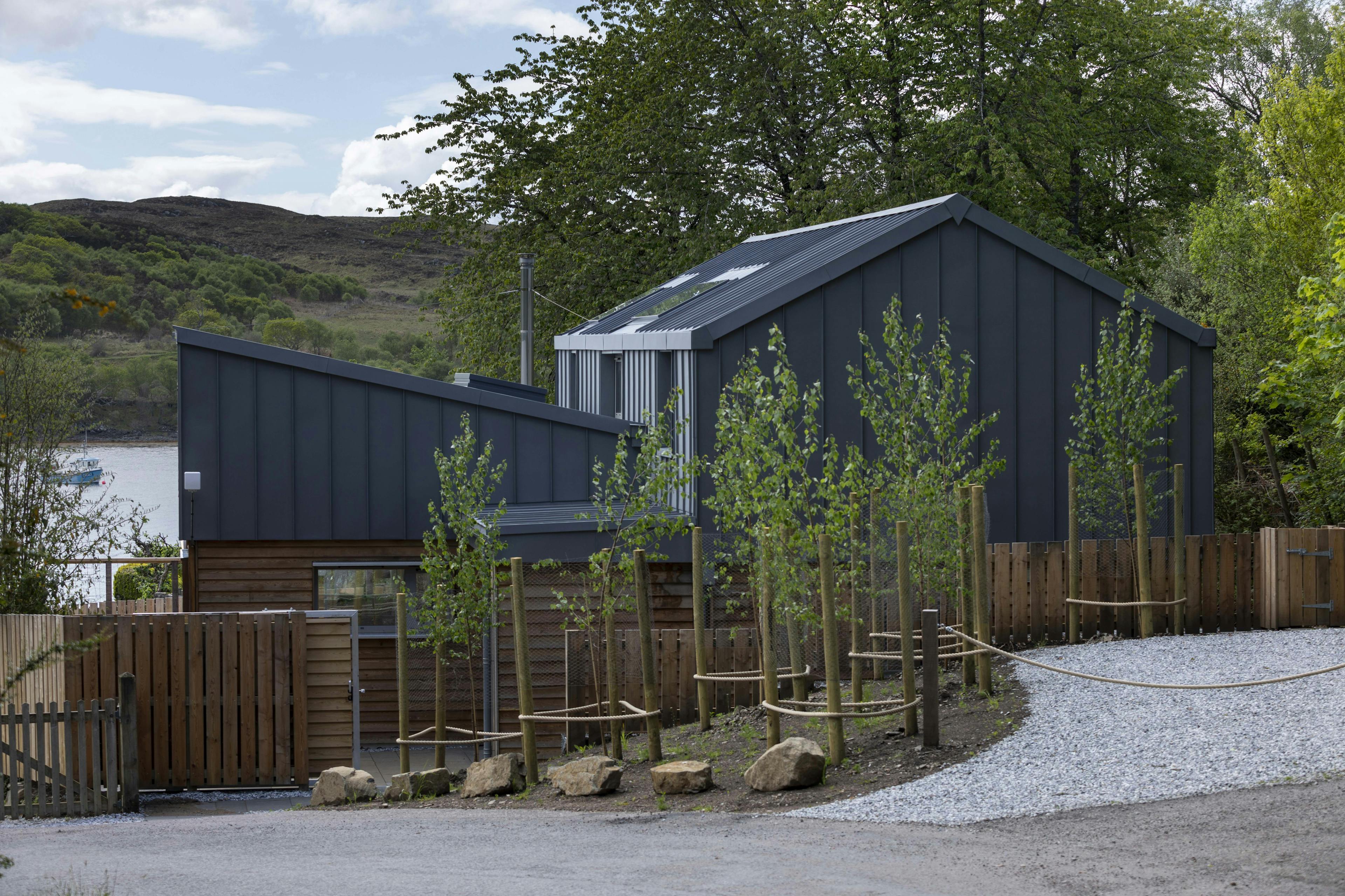 A new home built with a zinc roof and larch cladding