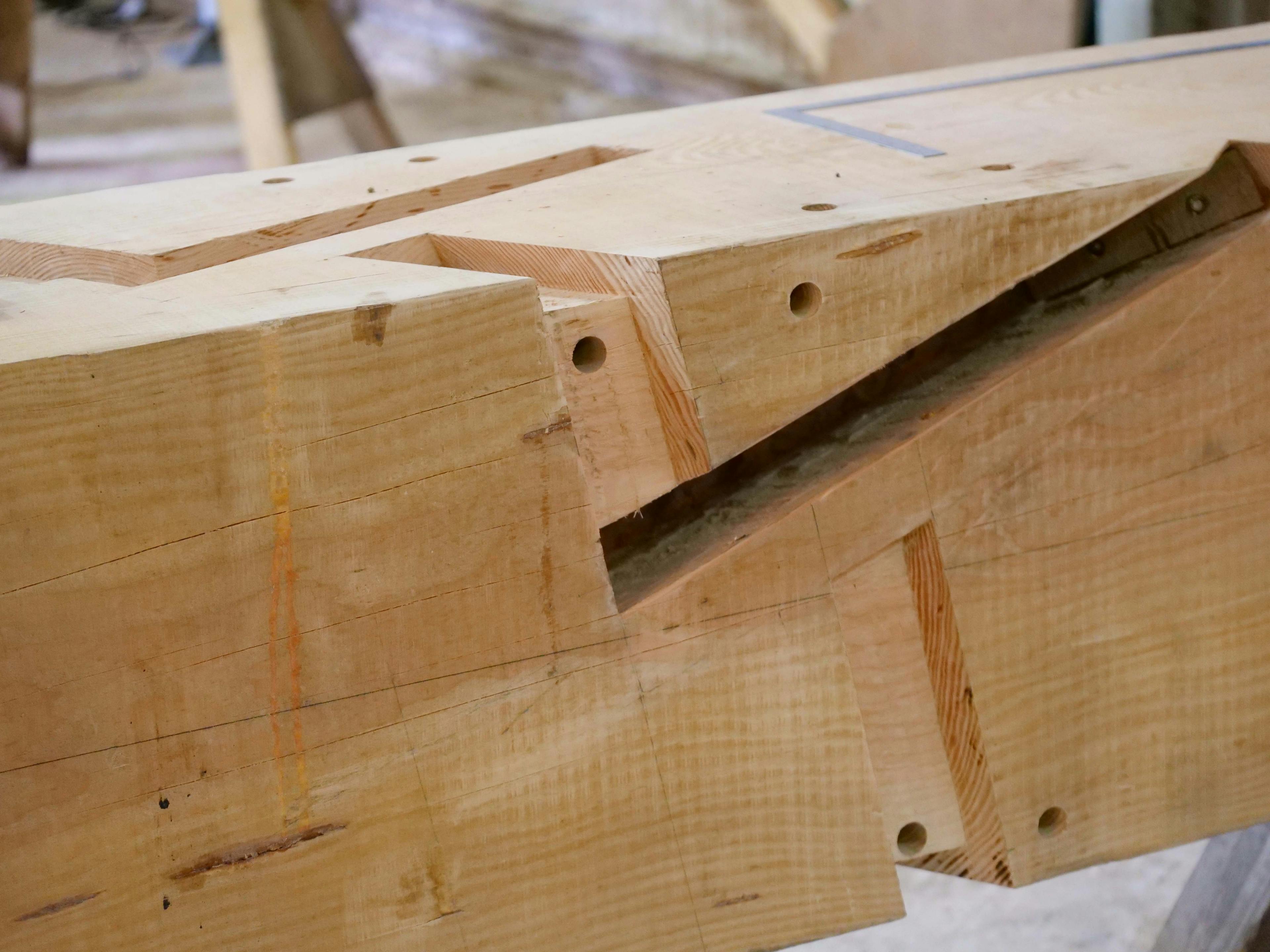 A piece of timber frame with connections cut into it