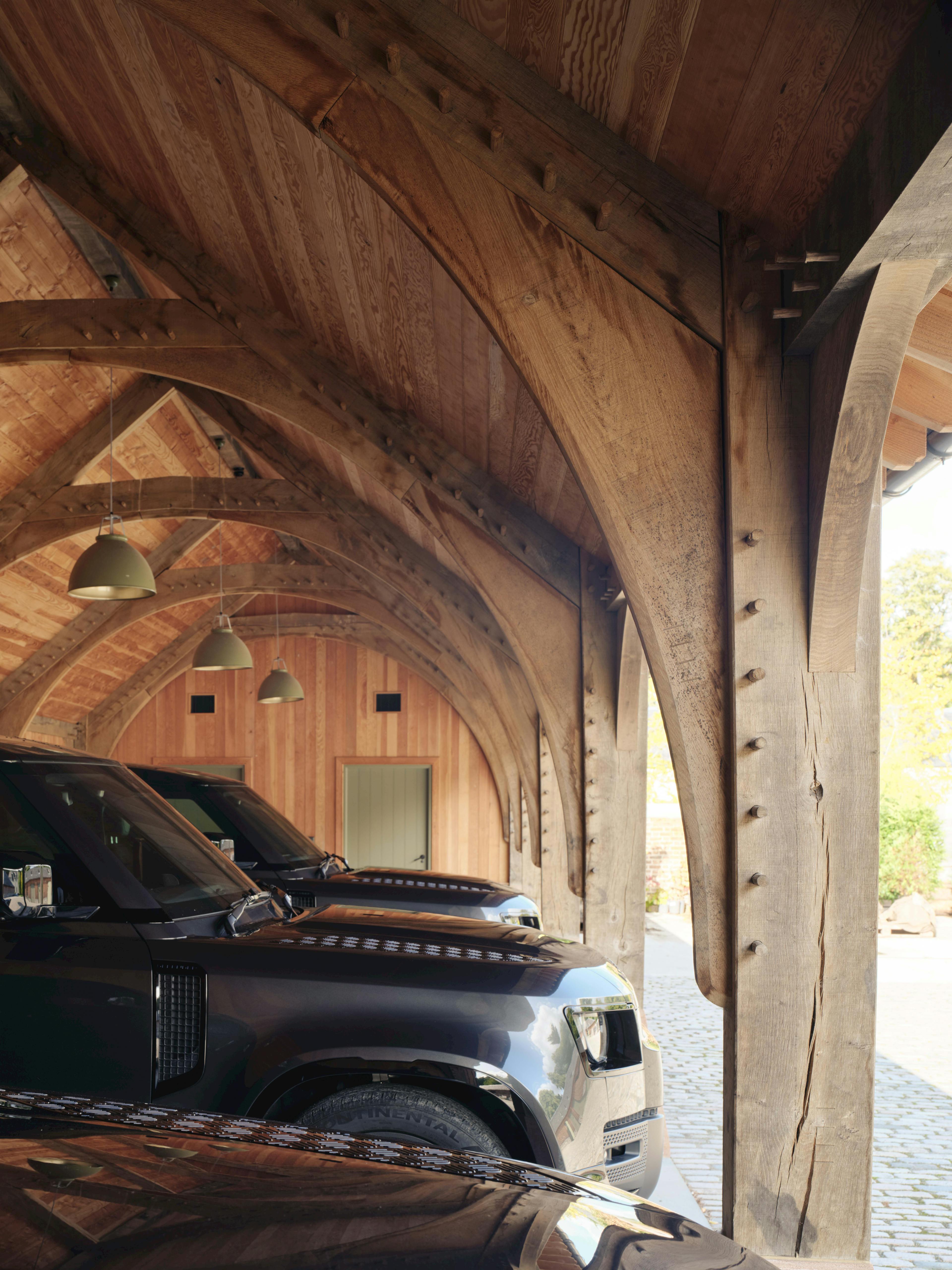 Interior view of a traditional oak-framed garage, showcasing classic trusses