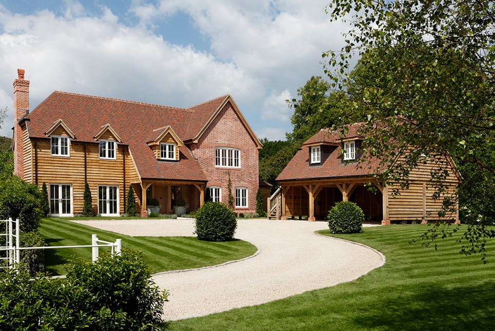 Open-front carport built with timber posts and beams