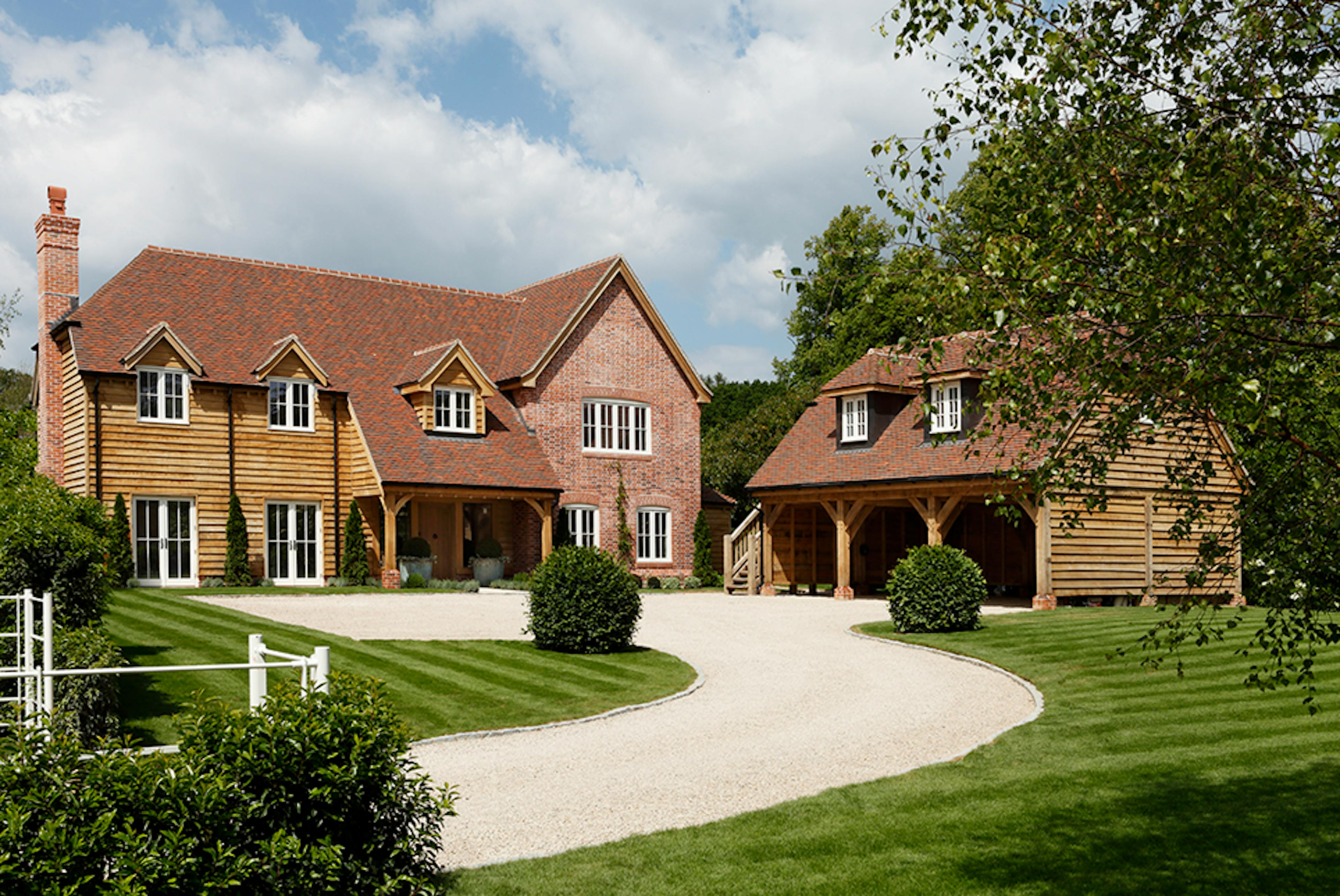 Open-front carport built with timber posts and beams