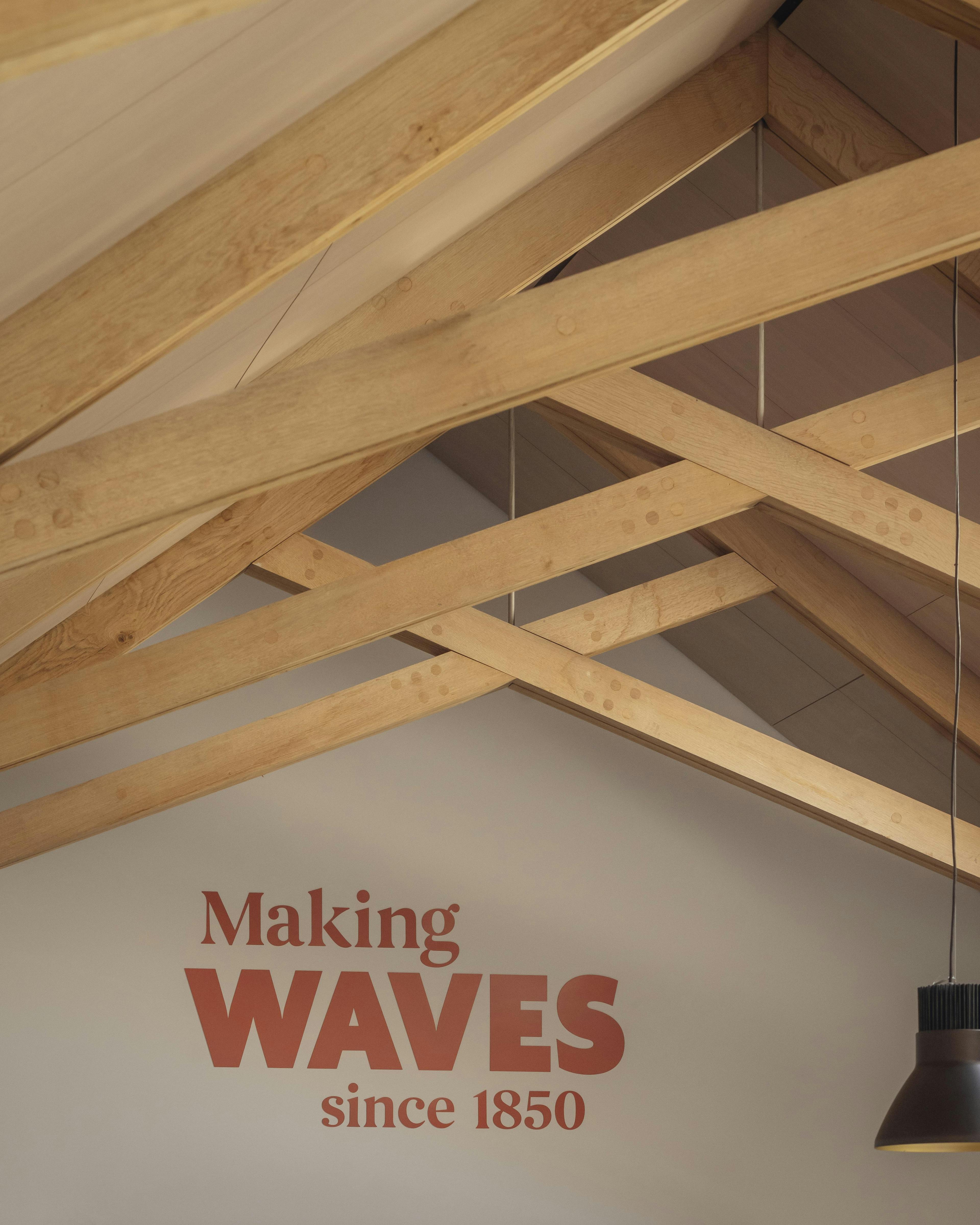 Interior of a school building with striking oak trusses in the roof