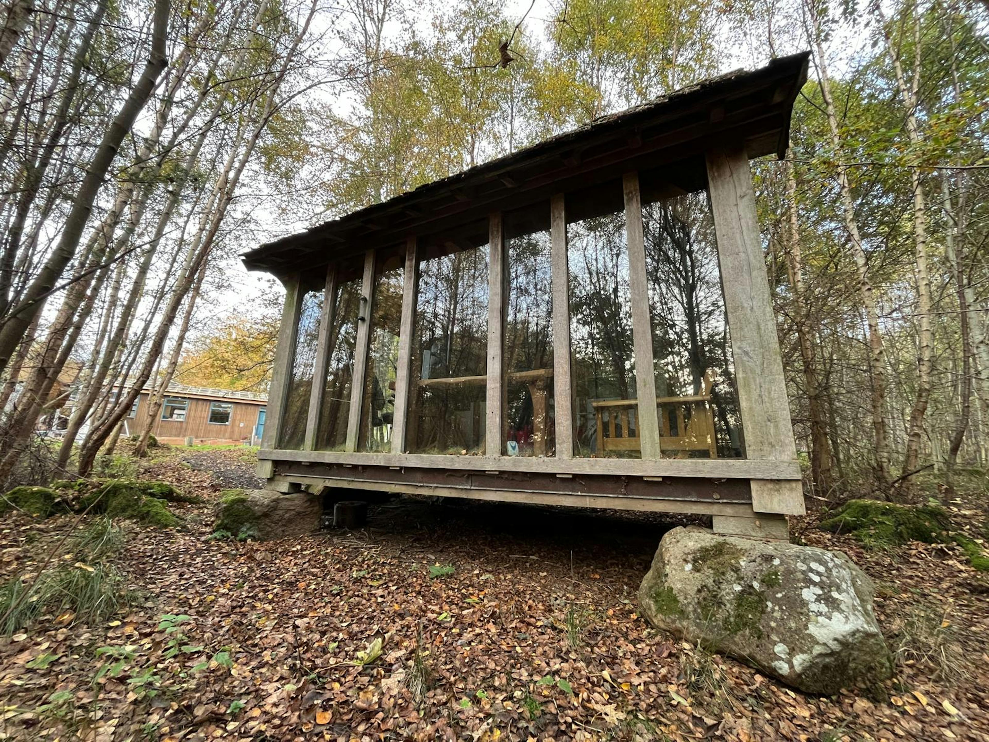 Completed oak timber frame for a small bothy in Scotland, assembled in the yard, with glazing installed, highlighting exposed beams and precise joinery